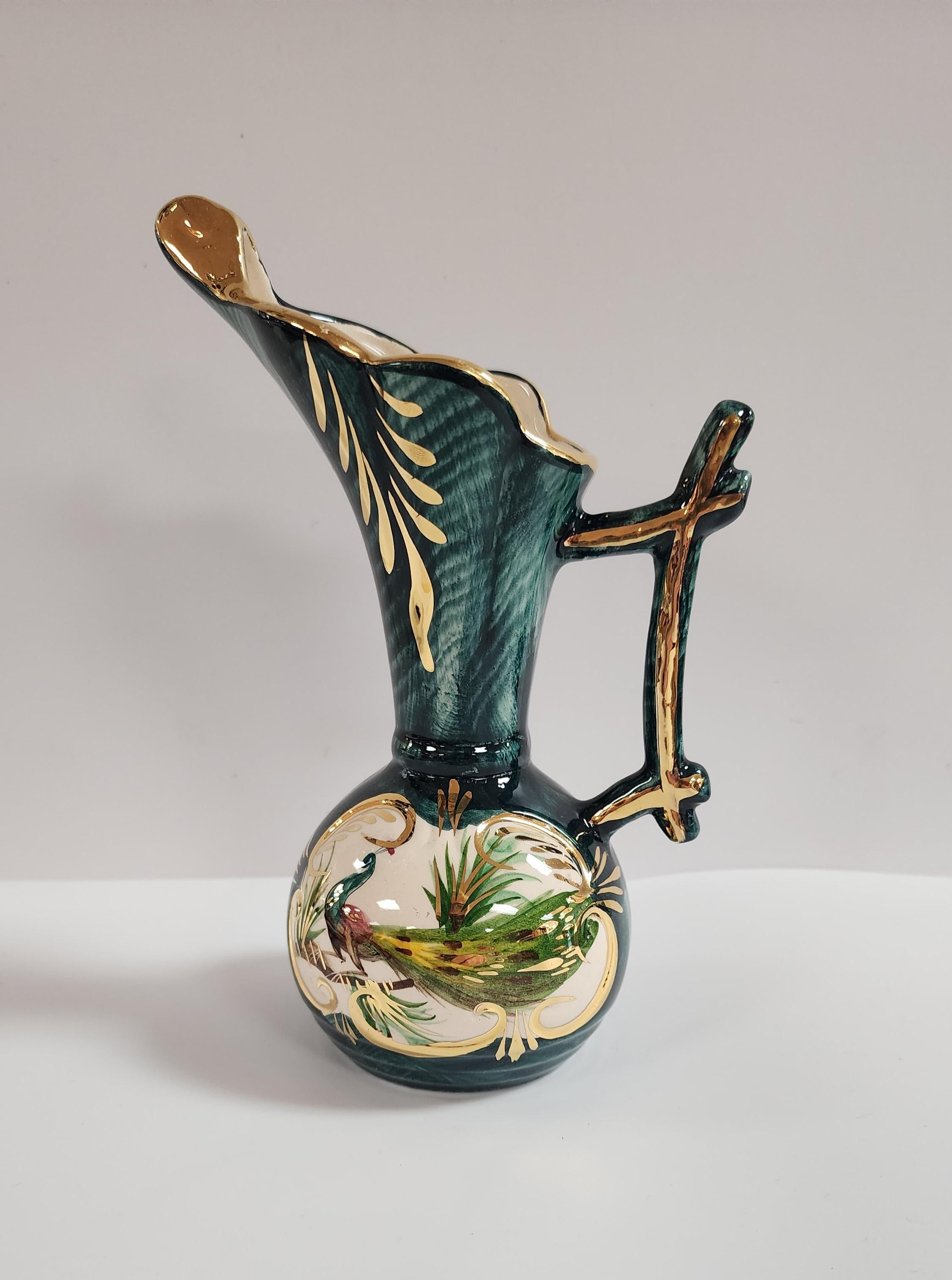 Very nice example of porcelain artist Hubert Bequet, this hand painted vase shows an artfully portrayed peacock with green field and gold accents. The bottom is stamped and the mark is clear and legible. 