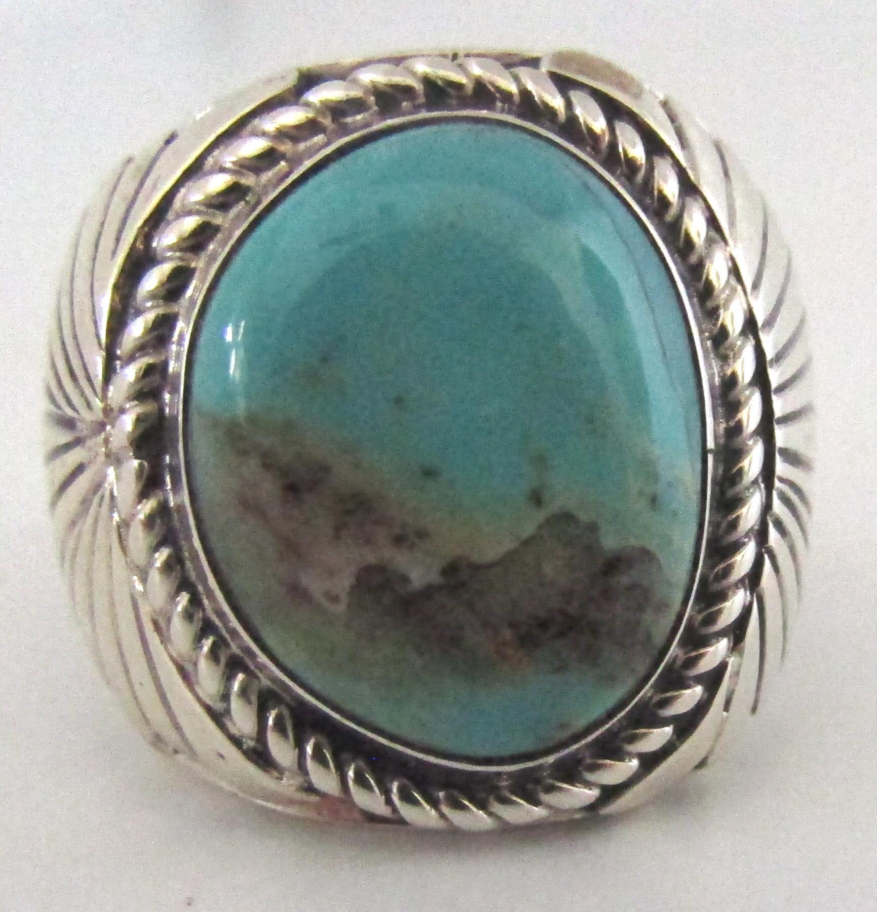 This highly collectible ring is signed by master Navajo silversmith H. Spencer. He has been creating pieces since the 1970s and is highly sought after. This sterling silver and Royston turquoise work of art is a size 10 and weighs 14.2 grams.The