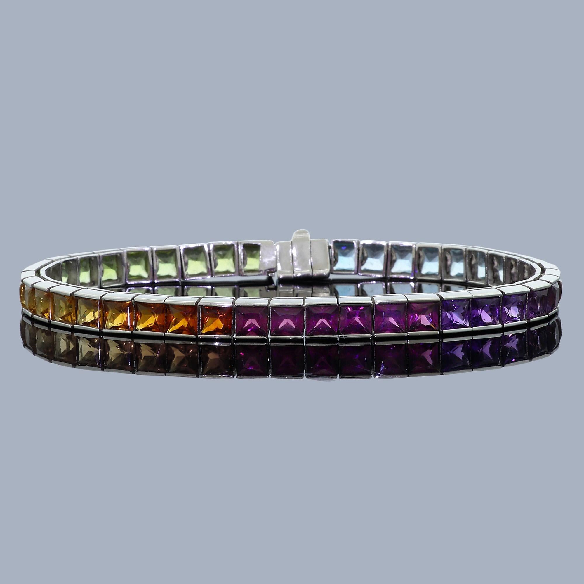 Purchased in the the late 1980's this beautiful bracelet is effortlessly elegant and timeless piece is sure to be There are beautiful 43 square / princess cut semi precious gemstones with well over 10 carats in total weight, set in 18k white gold.