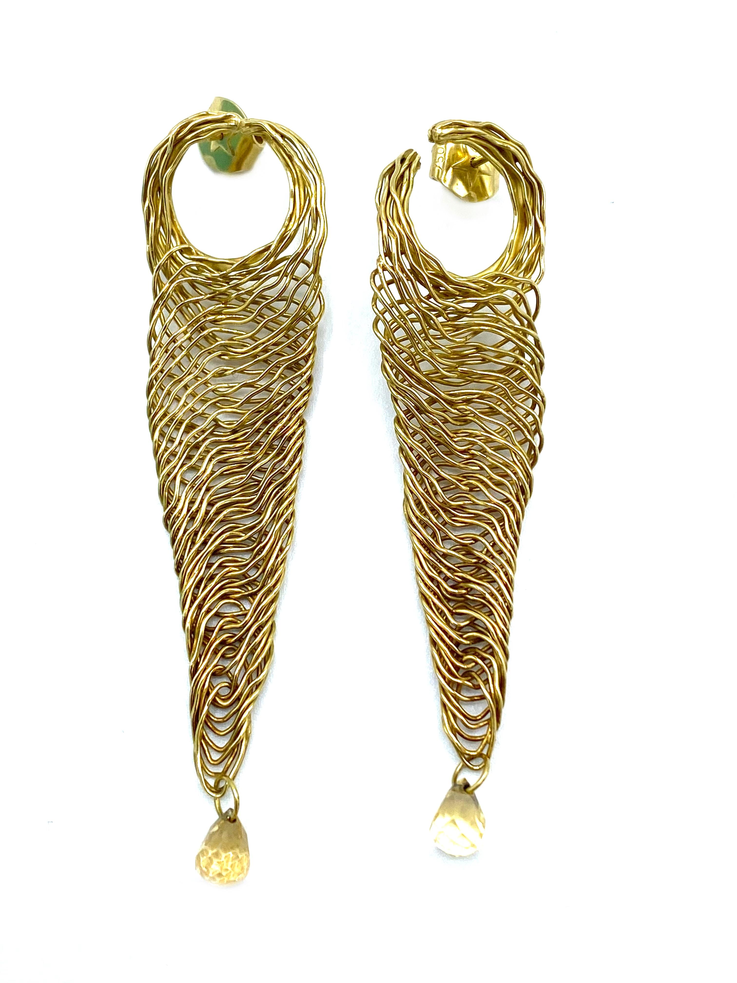 Product details:

The earrings are designed by H. Stern in 1990's, it is made out of 18 karat yellow gold and rutilated quartz. They feature wired finish and stud closure.
Total weight is 13.4 grams.
The measurements are 3 inches long and 0.75 inch