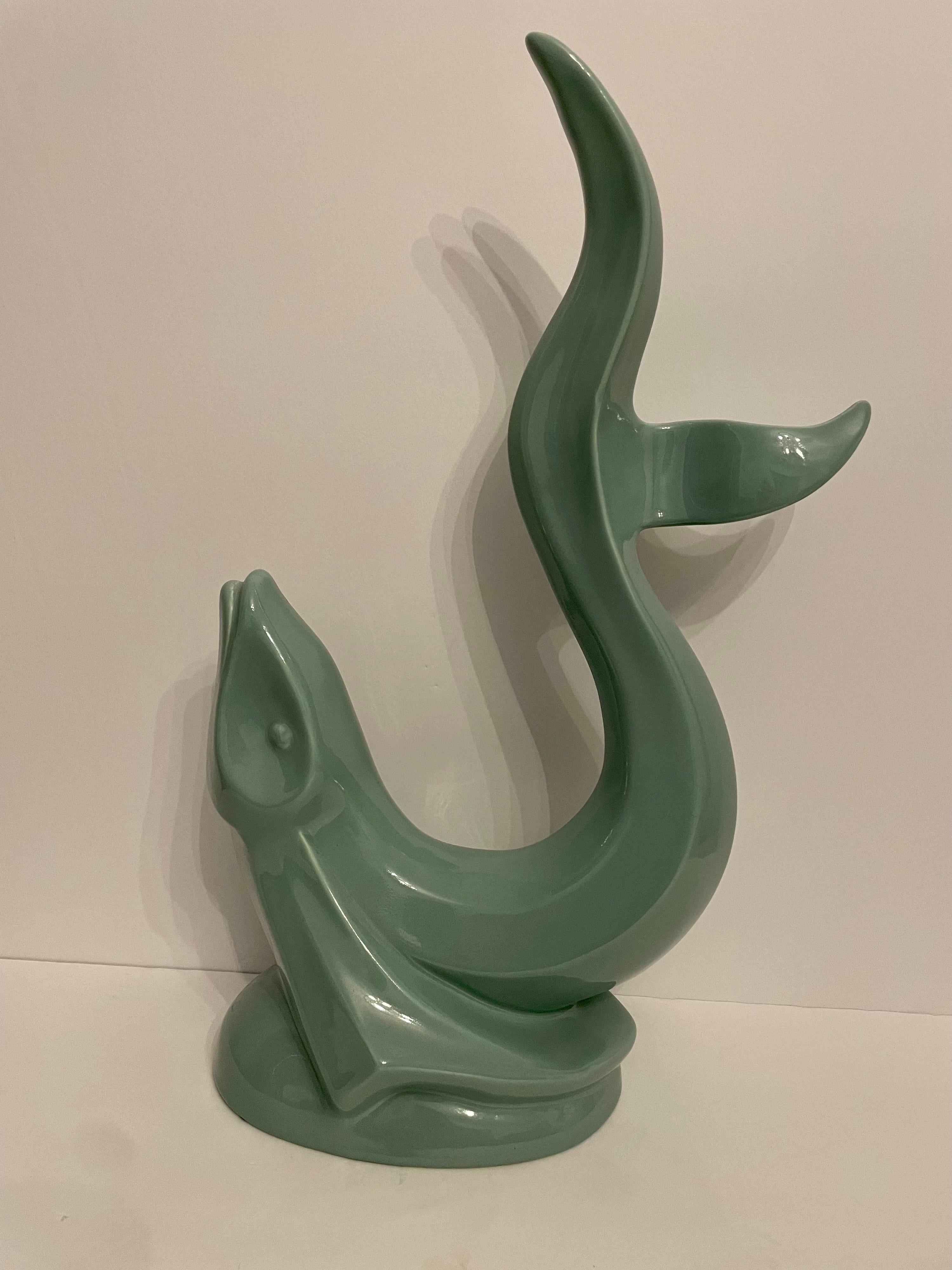 Vintage Haeger Aqua green colored ceramic Flying Fish Statue, depicted here as if the fish is getting ready to rush to the surface. Great color in great condition. Has Haegar tag intact.