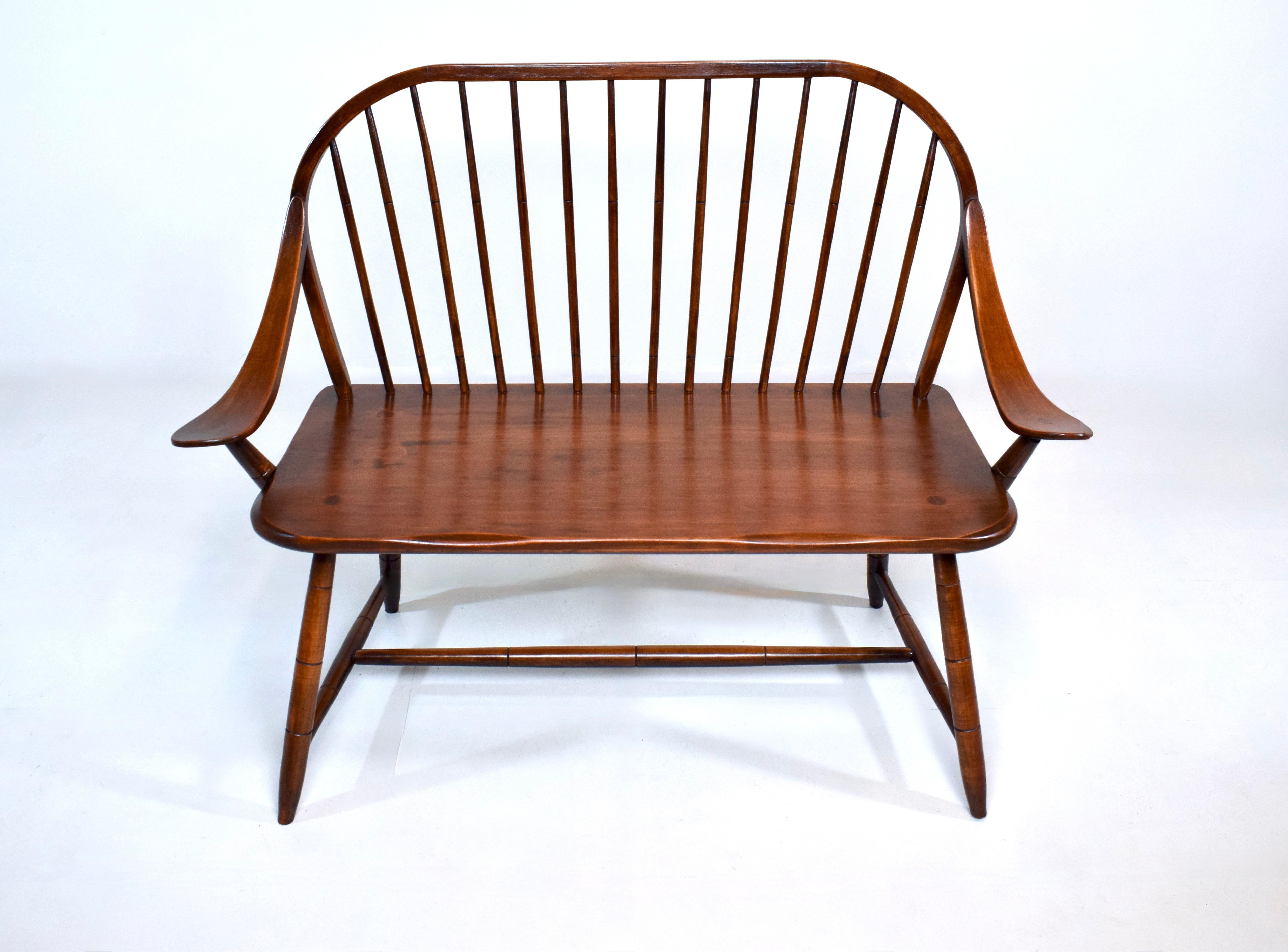 Hale of Vermont continuous bow & swag arm Windsor spindle back bench with full stretcher, Mortis & Tenon joinery, constructed of solid Maple.  Newly refinished in solid clean solid condition. Circa 1970.