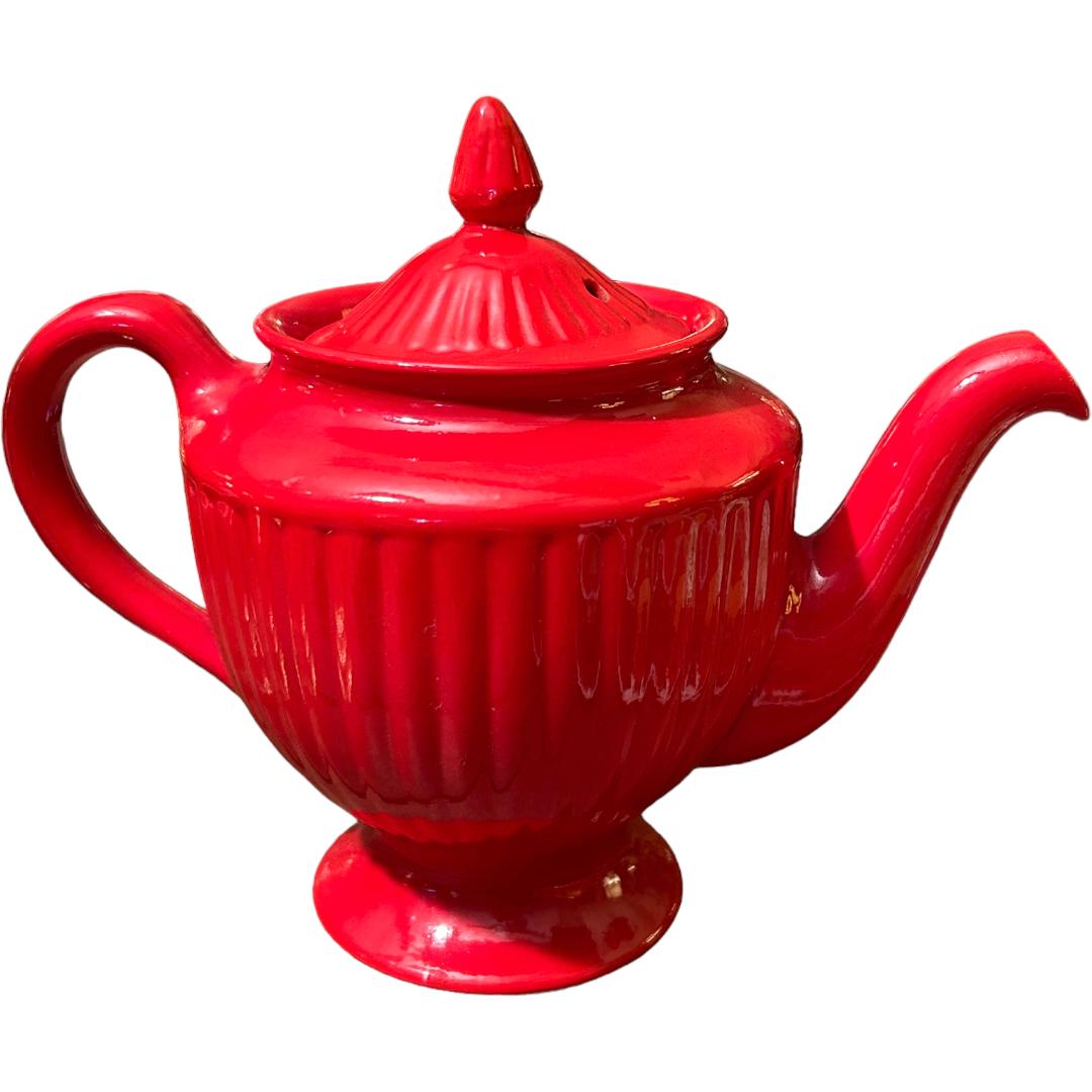 This vintage Hall pottery teapot in a stunning red color is a must-have for any collector of decorative cookware.  Crafted using traditional pottery techniques, this teapot is a beautiful addition to any kitchen or dining room.  The ribbed design