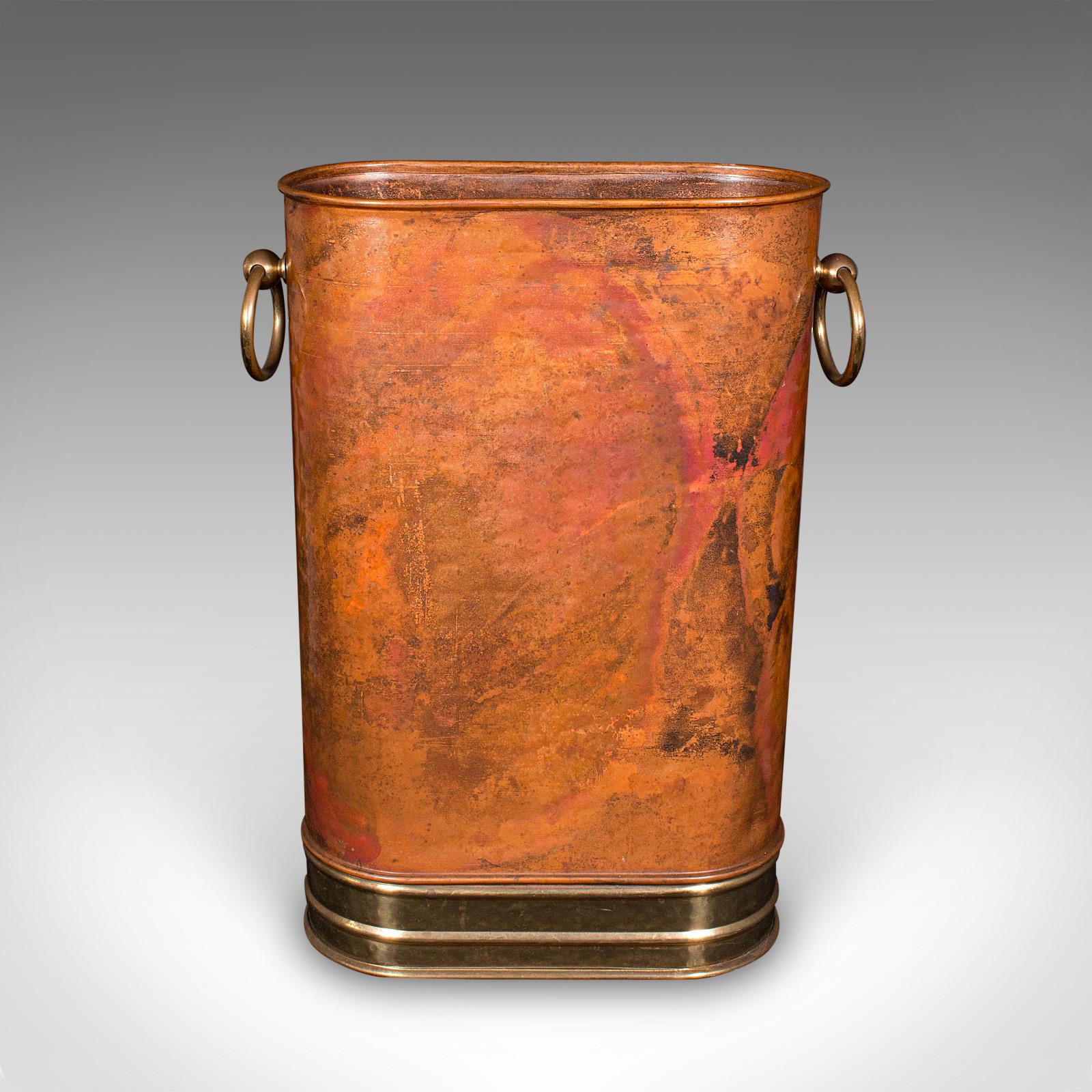 This is a striking vintage stick stand. An English, copper and brass umbrella rack in Art Deco revival taste, dating to the late 20th century, circa 1970. A graceful reception hall piece, offering visual allure with practical utility.

Distinctive