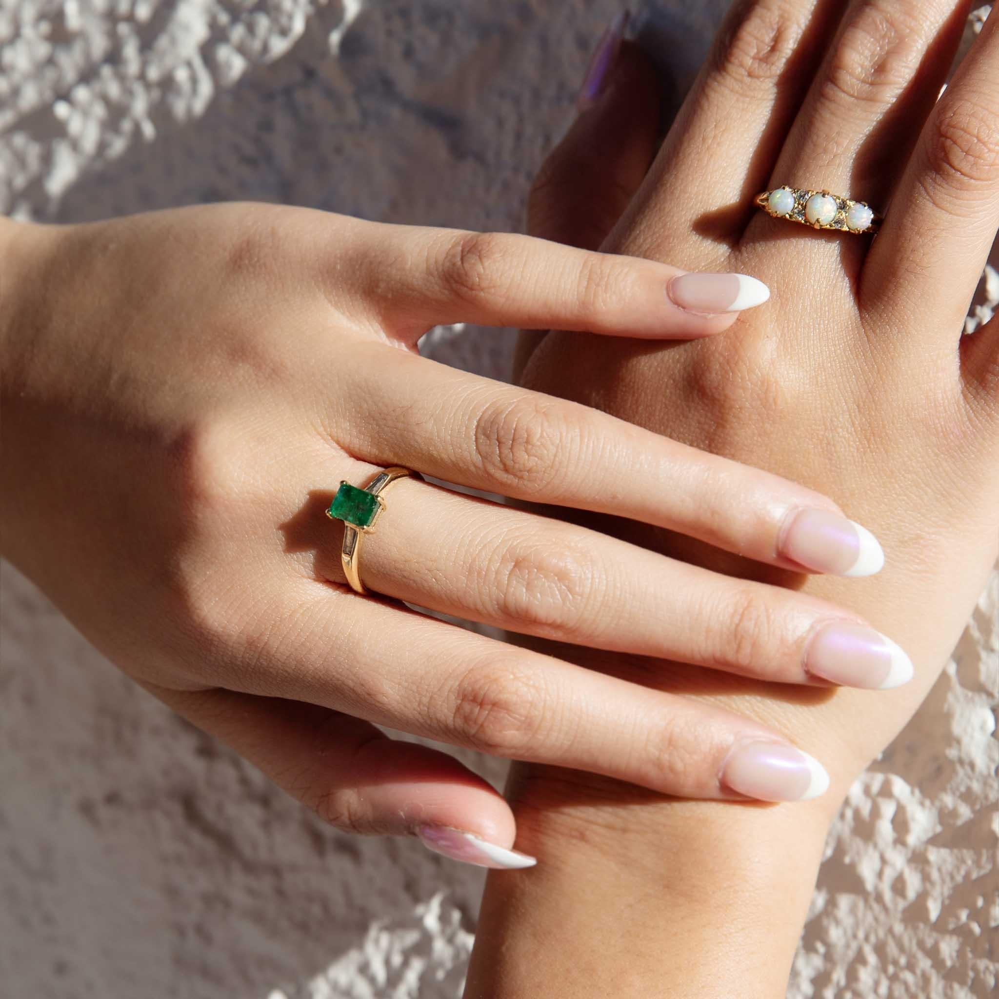 A gorgeous trio of Australian opals alternating with shimmering duos of diamonds rests upon a darling London Bridge setting. The Meryl Ring is a true delight, her gorgeous opals alive with green and orange play of colour. 

The Meryl Ring Gem