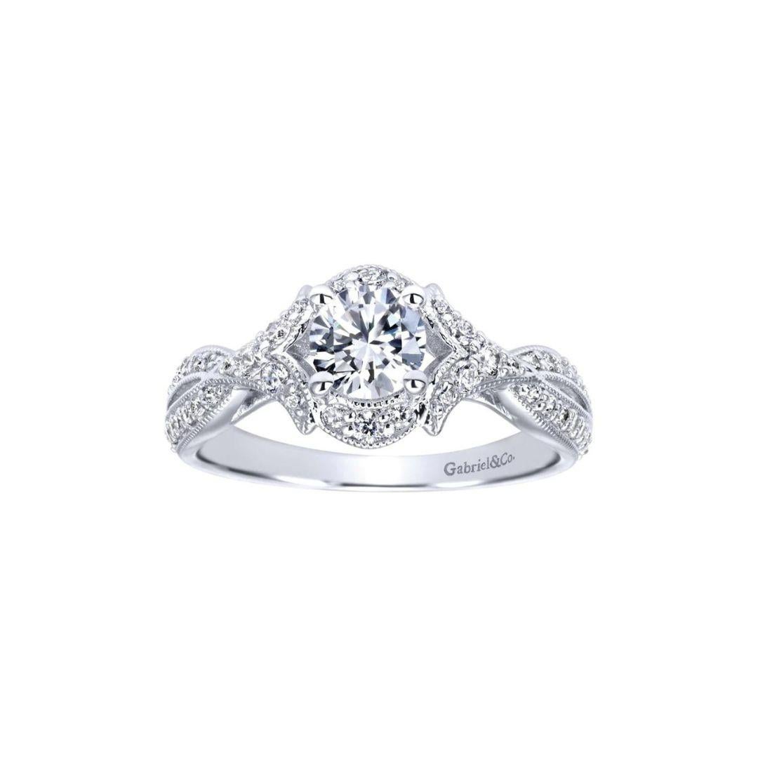 Vintage Halo Diamond Engagement Ring in 14k White Gold.﻿ Flared pave diamond shoulders hug the center diamonds in a bow fashion, wrapping around it to form an elegant vintage style halo. Center diamond weighs 0.46 ct, G-H color, VS2 clarity. Side