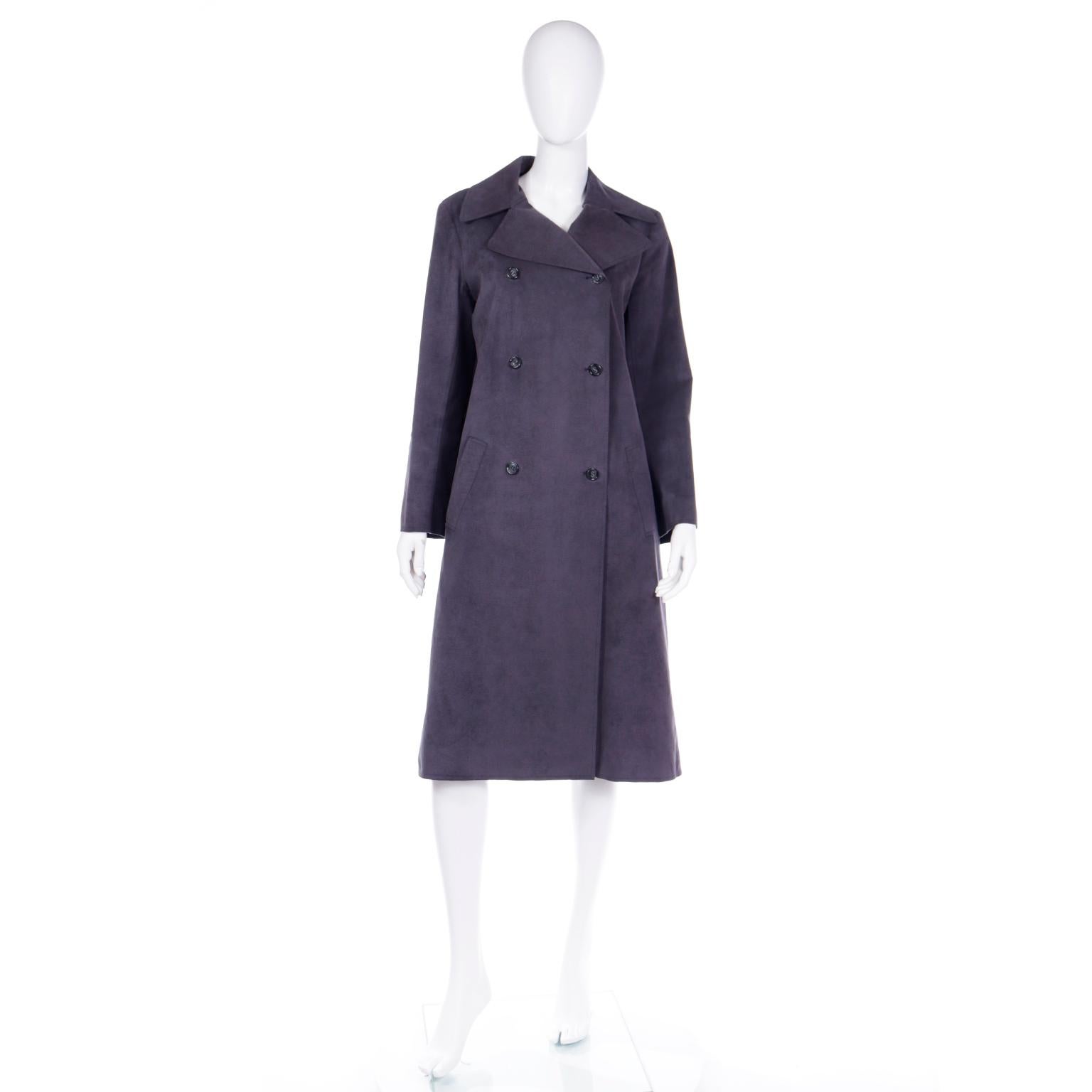 This vintage Halston double breasted steel grey ultra suede coat was made in the USA in the 1970's. This coat was sold at Woolf Brothers and it is one of those Halston pieces that are a must for collectors. The coat has notched lapels, front buttons