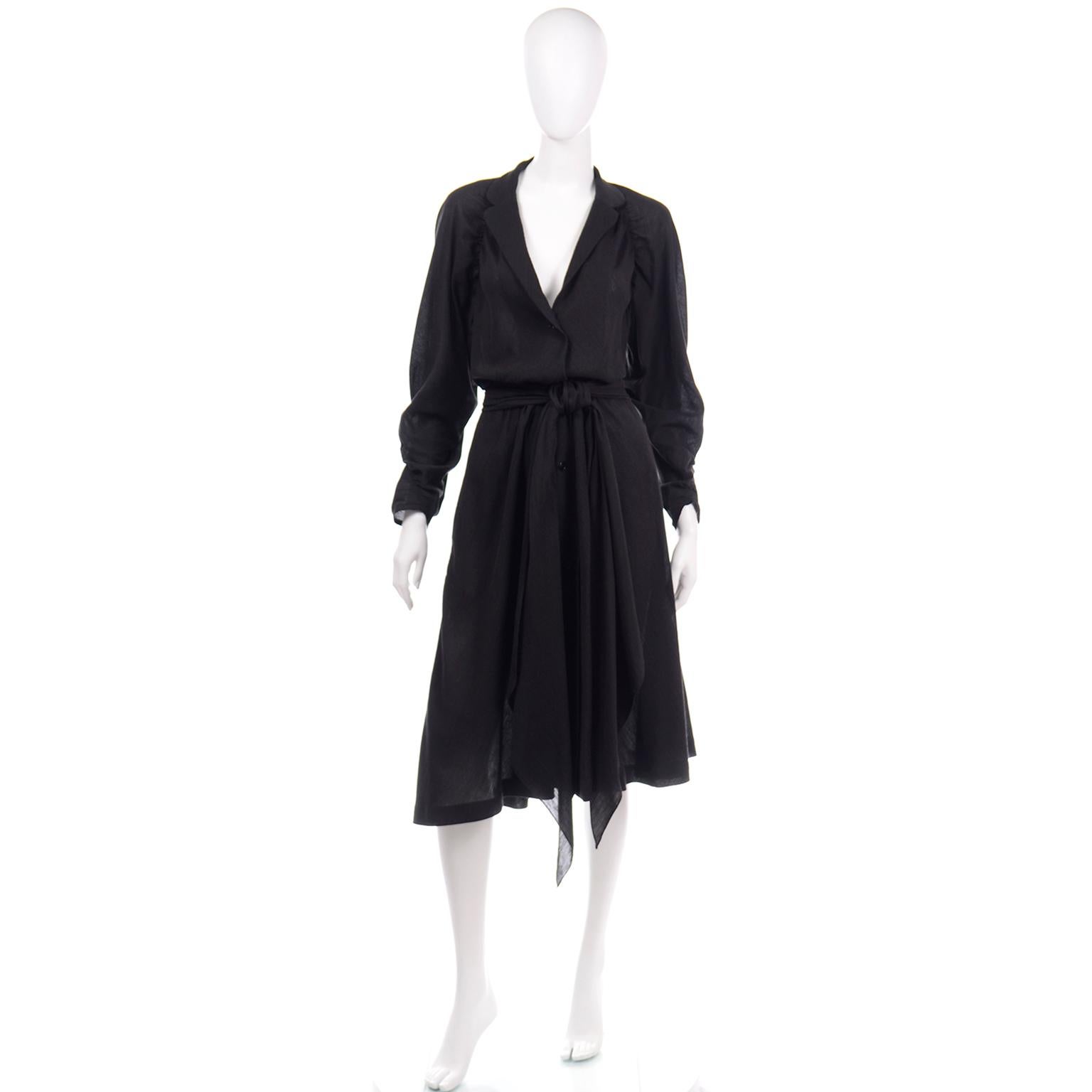 This is a vintage 1970's Halston black cotton voile dress with a deep v neckline and cinched underarm details that wrap around the back of the sleeves. Though it is effortless to wear, the dress has the familiar Halston styling and is so much