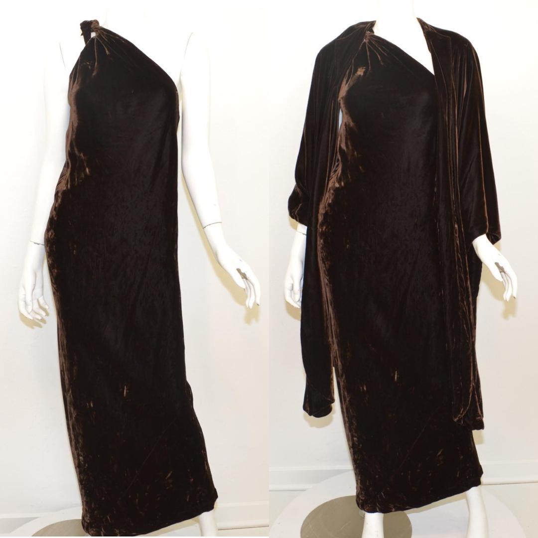 Vintage Halston ensemble is featured in a dark brown color composed with beautiful crushed velvet fabric. Dress has a one-shoulder design and a hook-and-eye fastening at the shoulder in addition to a tie fastening, and is fully lined. 

vintage