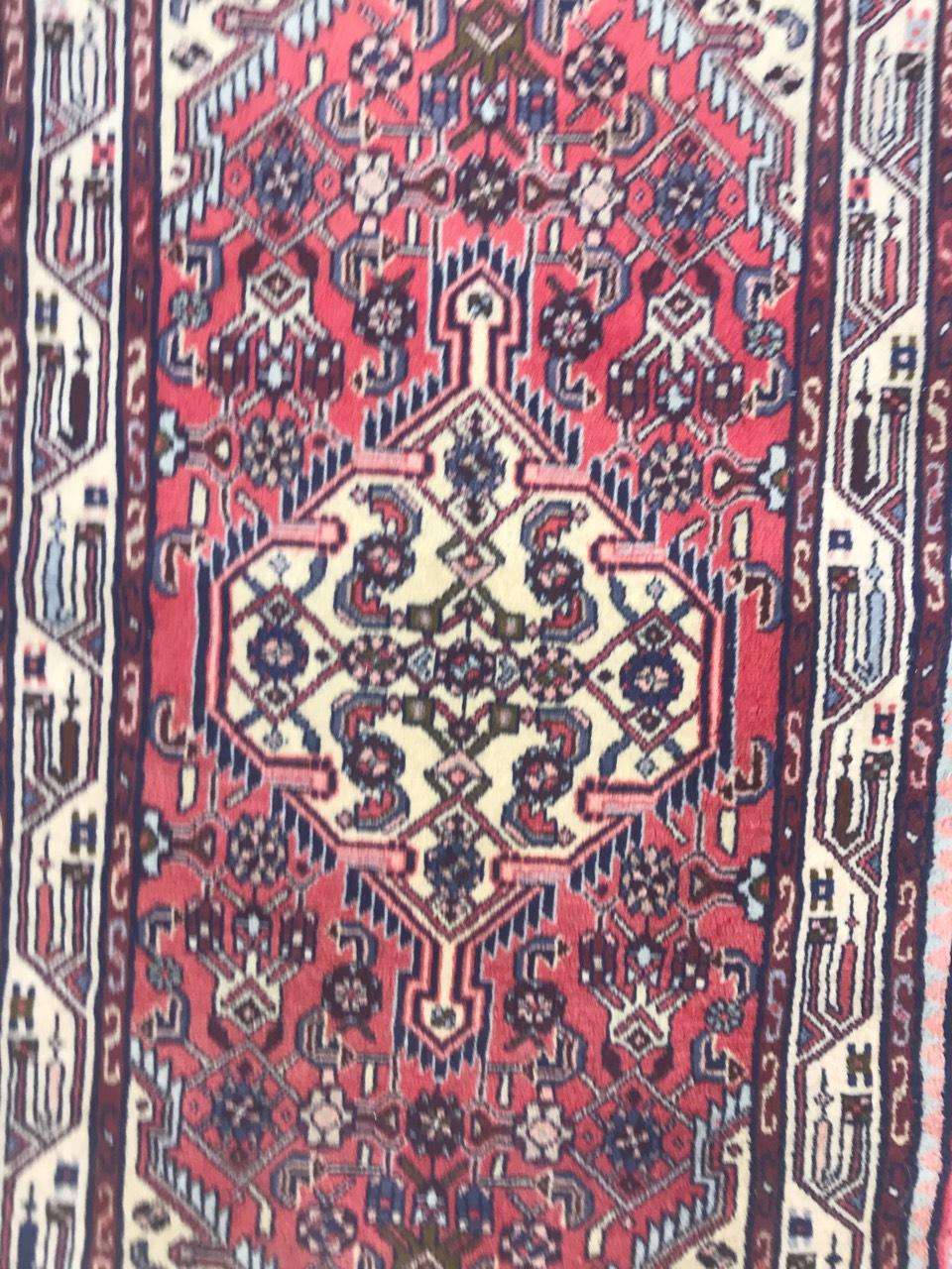 Beautiful late 20th century rug with a tribal design, pink field color, entirely hand knotted with wool velvet on cotton foundation.

 