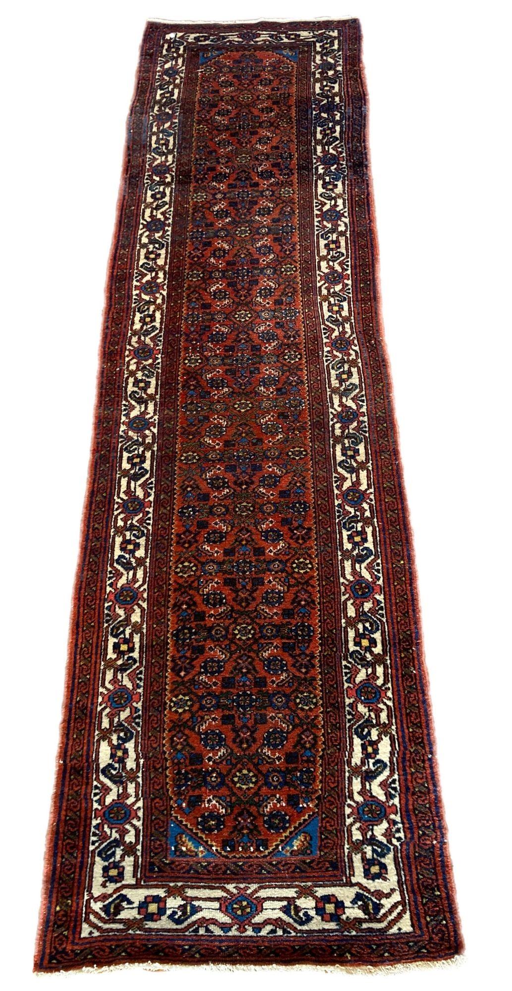 A beautiful vintage Hamadan runner, handwoven circa 1940 with a traditional Herati design on a terracotta field and ivory border. Lovely secondary colours of greens and golds and a good narrow size.
Size: 2.83m x 0.77m (9ft 4in x 2ft 6in)
This rug