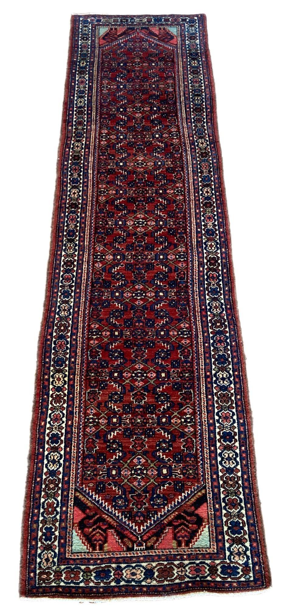 A beautiful vintage Hamadan runner, handwoven circa 1940 with a traditional Herati design on a terracotta field and ivory border. Lovely secondary colours of pinks and blues and a good narrow size.
Size: 2.97m x 0.77m (9ft 9in x 2ft 6in)
This rug