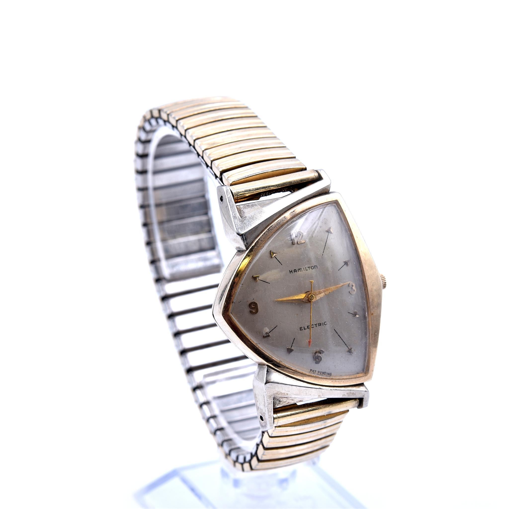 Movement: quartz
Function: hours, minutes, seconds
Case: “arrowhead” shaped yellow gold-filled case with flexible bracelet, plastic crystal
Dial: champagne dial with gold arabic numerals, gold indexes
Serial: S342317
**This watch is not working,