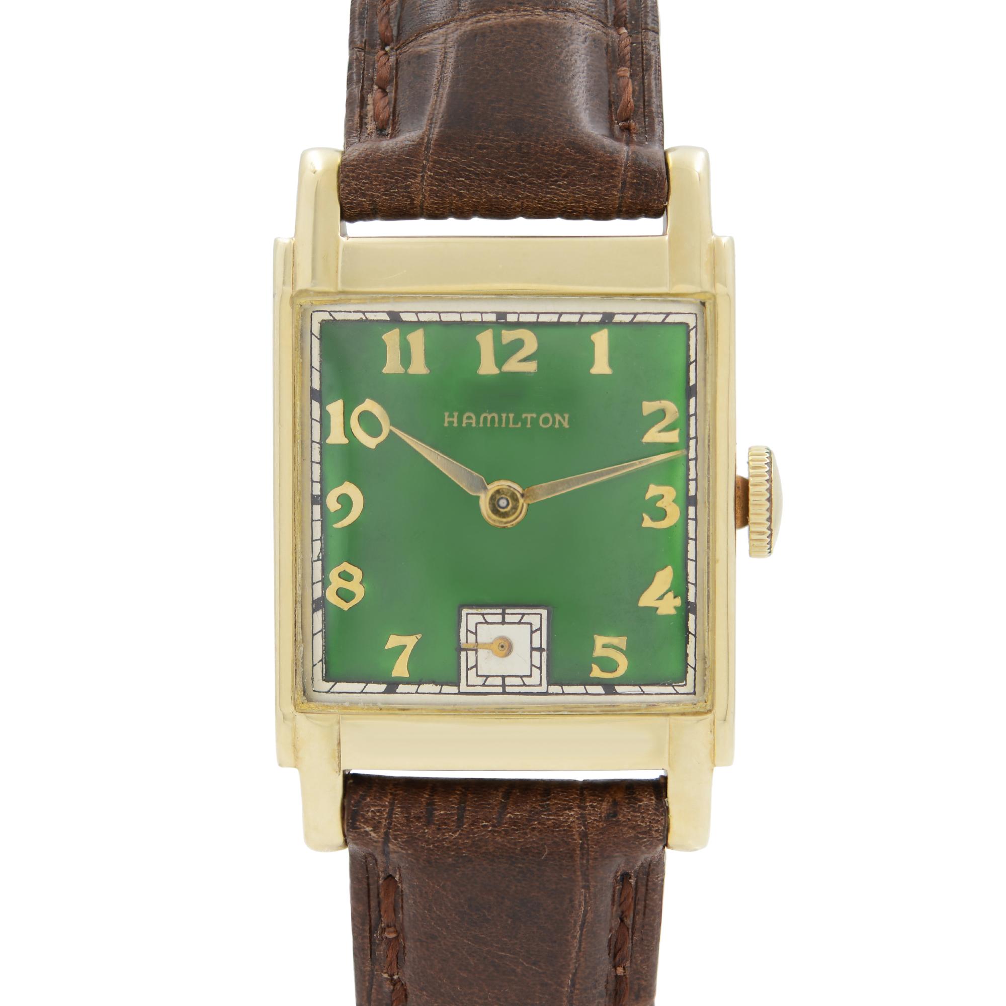 Pre Owned Hamilton 14k Gold Filled Custom Green Dial Brown Leather Strap Men's Watch. Custom Gren Dial.  Some glue signs on the dial during customization and refinishing. Aftermarket band and buckle. No Original Box and Papers are Included. Comes