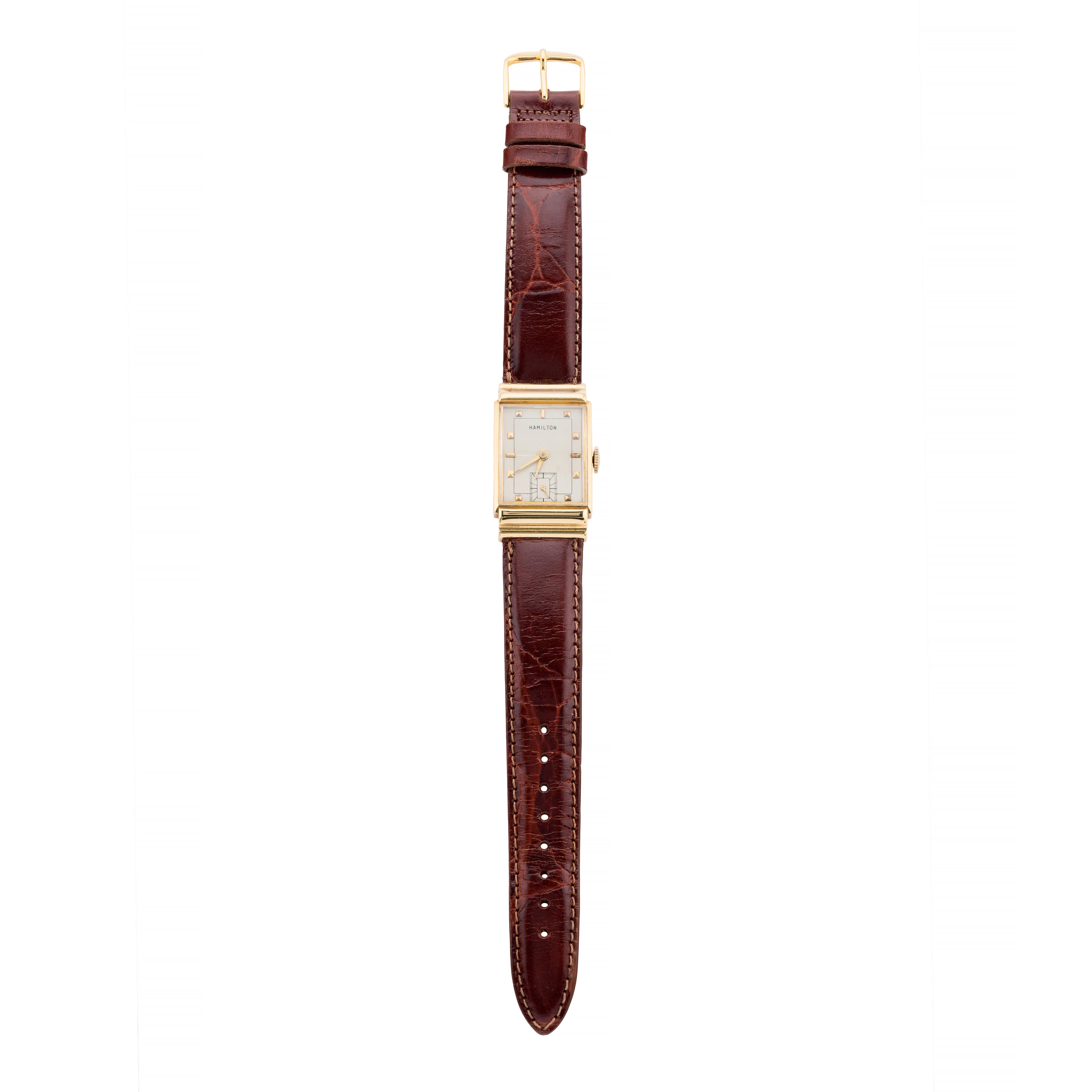 Aston Estate Jewelry Presents:

A distinguished Hamilton 'Gordon' wrist watch in 18 karat yellow gold. This Art Deco timepiece exemplifies the elegance and precision of its era. Crafted with a hidden lug rectangular gold case, it measures 38.0mm in