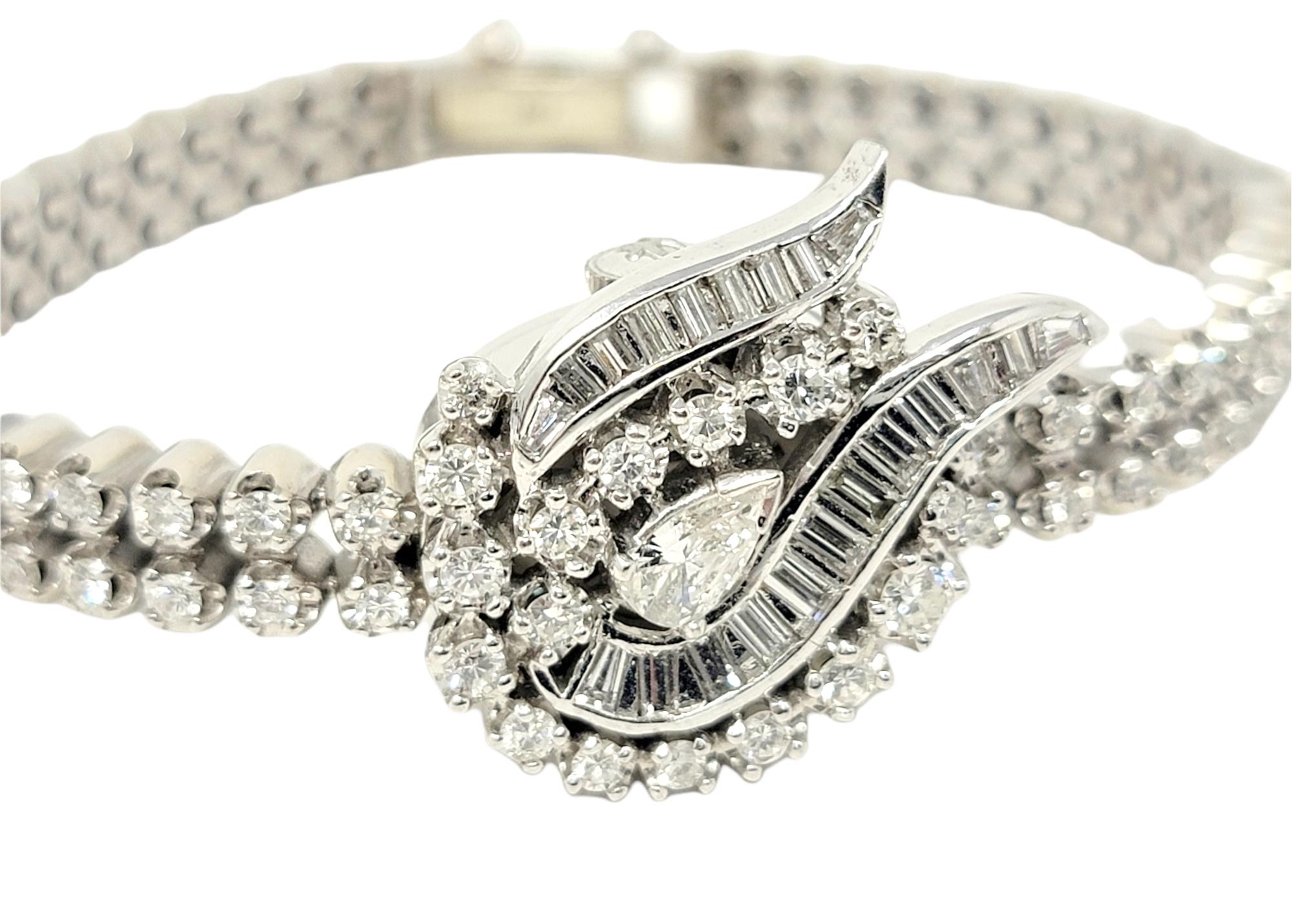 Exquisite vintage Hamilton ladies wristwatch / bracelet embellished with 3.00 carats of glittering natural diamonds. The flexible white gold bracelet gently wraps the wrist while the 124 sparkling diamonds shimmer and shine from all angles. The face