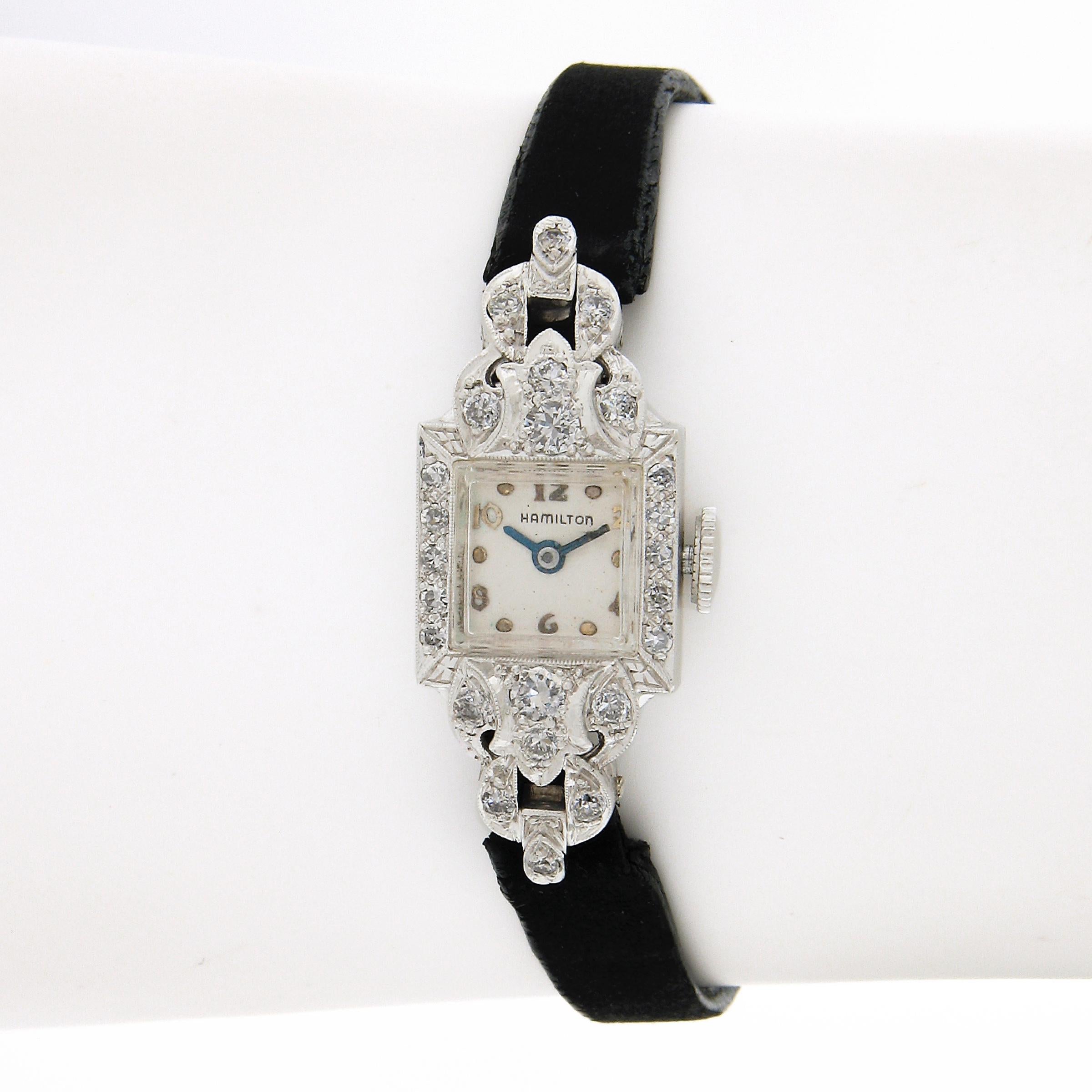 Here we have an elegant and classic vintage Hamilton ladies' watch mounted in a solid platinum case that is covered with approximately 0.45 carats of fine quality diamonds. The watch comes w/ a generic leather strap that shows some wear yet still in