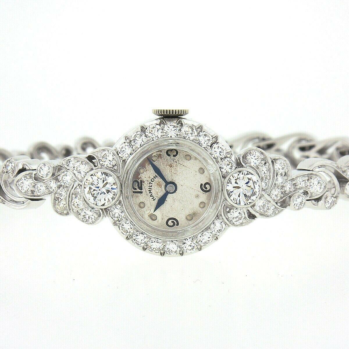 Here we have a very fancy vintage Hamilton ladies' watch that was mounted in the most elegantly designed case and bracelet, both crafted in solid platinum and are completely covered throughout with approximately 4.44 carats of the finest quality