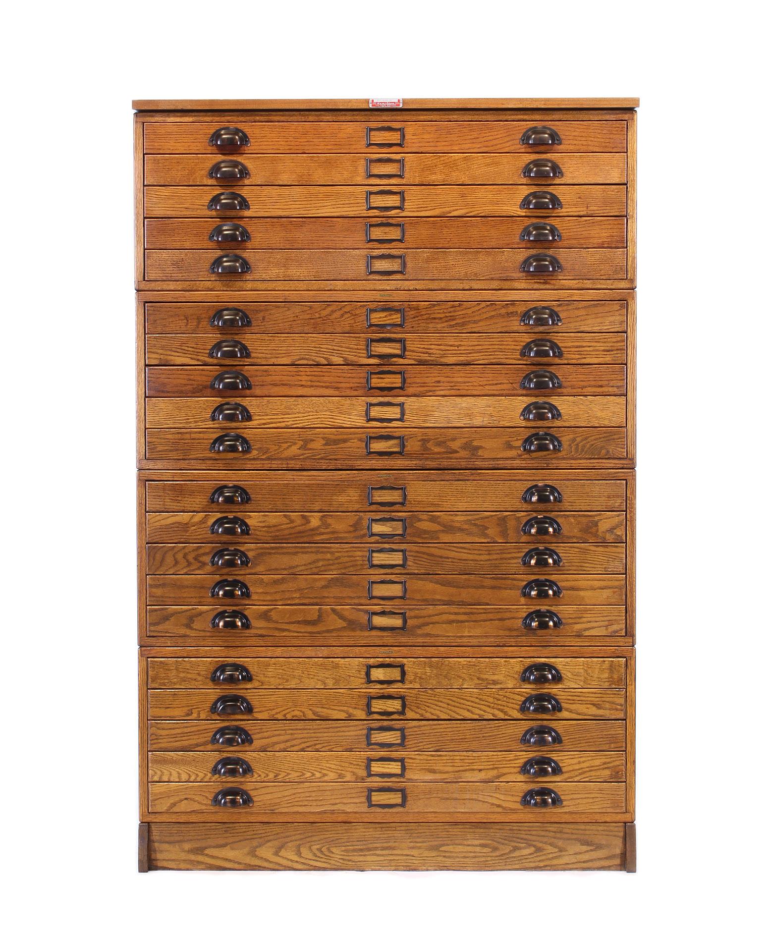 Vintage Hamilton oak 20 drawer flat file storage cabinet. In six sections, four cabinets, top and base. Overall dimensions: 40 3.4