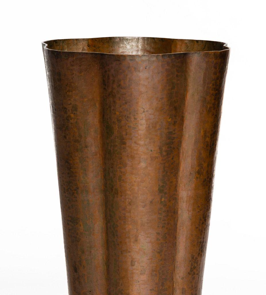 This Vintage Hammered copper vase is an original decorative object realized by a Faenza Manufacturer in the early 20th century. 

Signed by Angelo Molignoni. Made in Italy.

Turned hand-hammered copper vase with conical truck