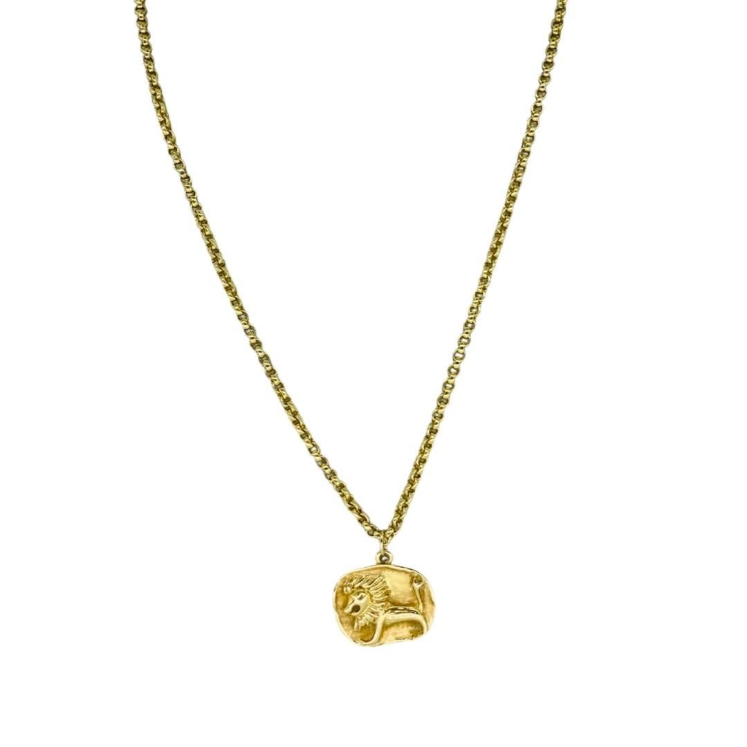 Vintage Long Hammered Leo Lion Zodiac Pendant 14 Karat Gold 30 Inch. The chain has no lock and is worn over the head and measures 28 inches in length. With pendant the total length is 30 inches. The pendant measures 27mm X 23mm. The total weight is