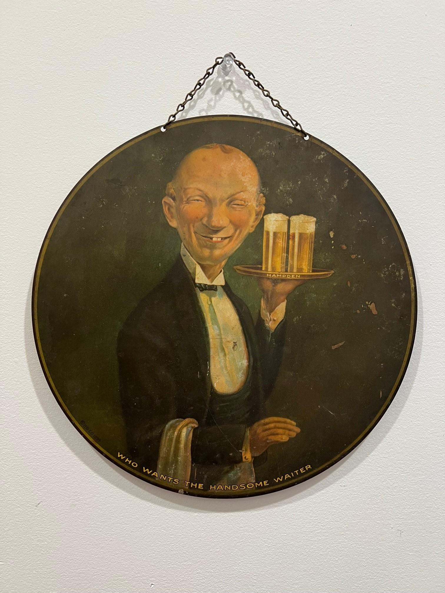 Vintage original early tin litho chain hung advertisement sign for Hampden Brewing Company, featuring the companies goofy looking handsome waiter. The Hampden brewing company Who Wants The Handsome Waiter tin sign is in good condition with minor