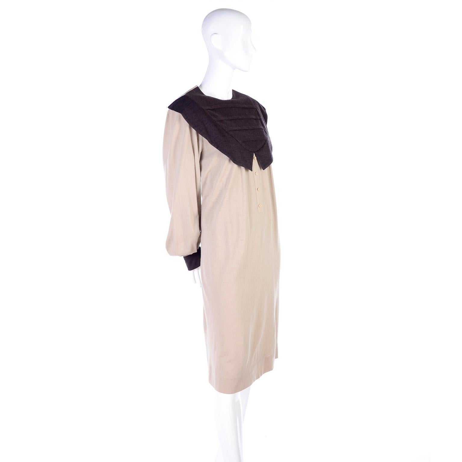 This is a great Hanae Mori vintage tan/taupe dress with an exaggerated pleated pilgrim collar in dark brown. The cuffs can be worn up or down, and have dark brown on the reverse side. This loose fitting dress has four decorative buttons down the