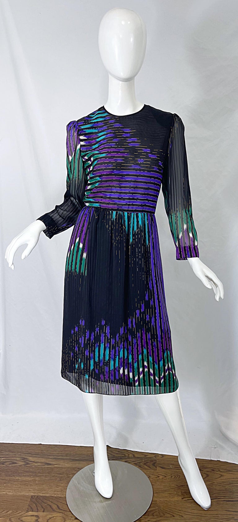 Amazing early 1980s Japanese designer HANAE MORI for NEIMAN MARCUS abstract print long sleeve silk chiffon dress ! Features a black background with vibrant pops of abstract shapes and chevron stripes of purple, green, turquoise, blue and white. Very