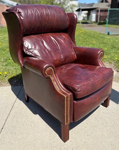 Vintage Hancock and moore burgundy leather wing back chair/recliner