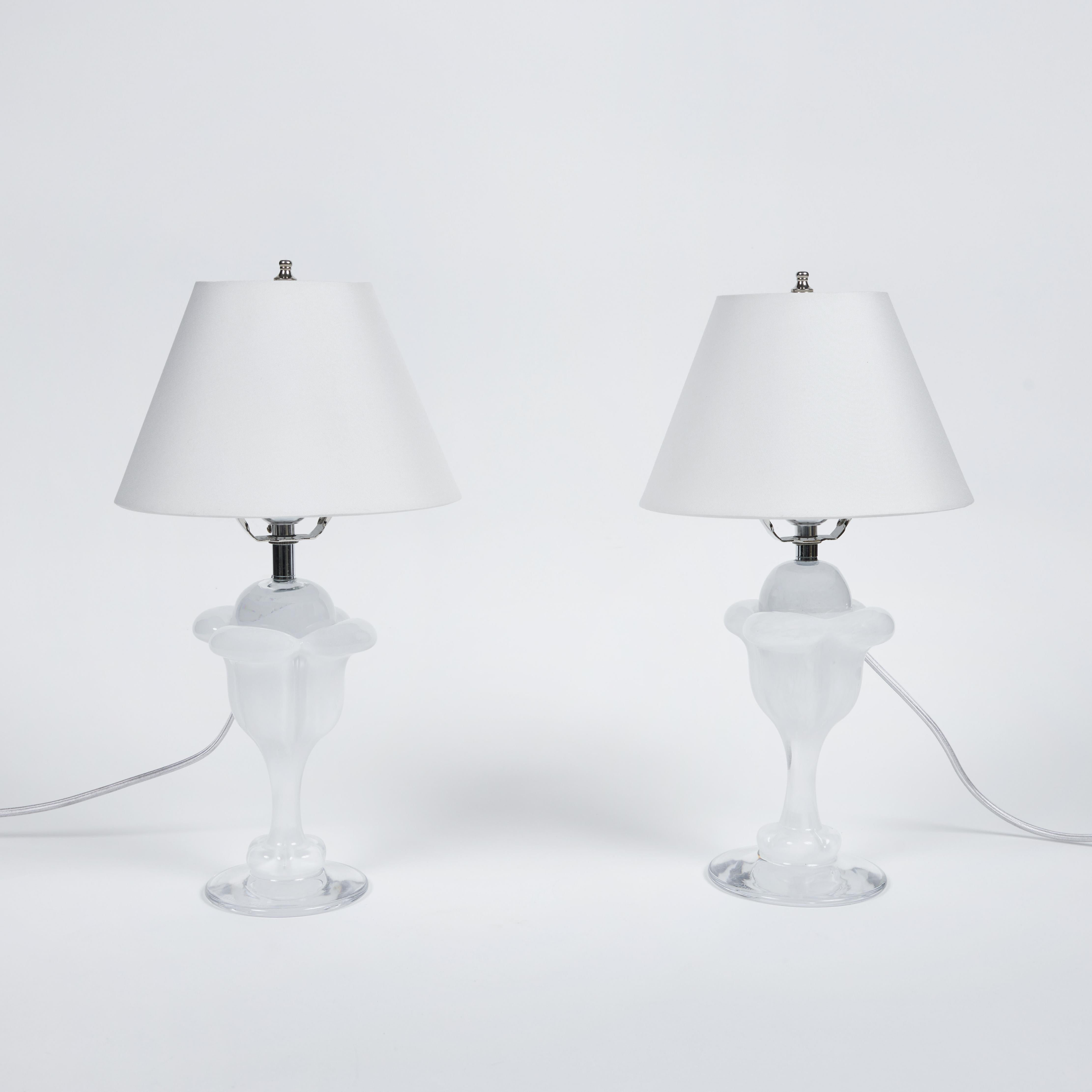 This charming petite pair of hand blown clear and marbled white crystal tulip shaped based lamps are paired with lovely new custom silk shades. 

They are newly rewired, measure 15
