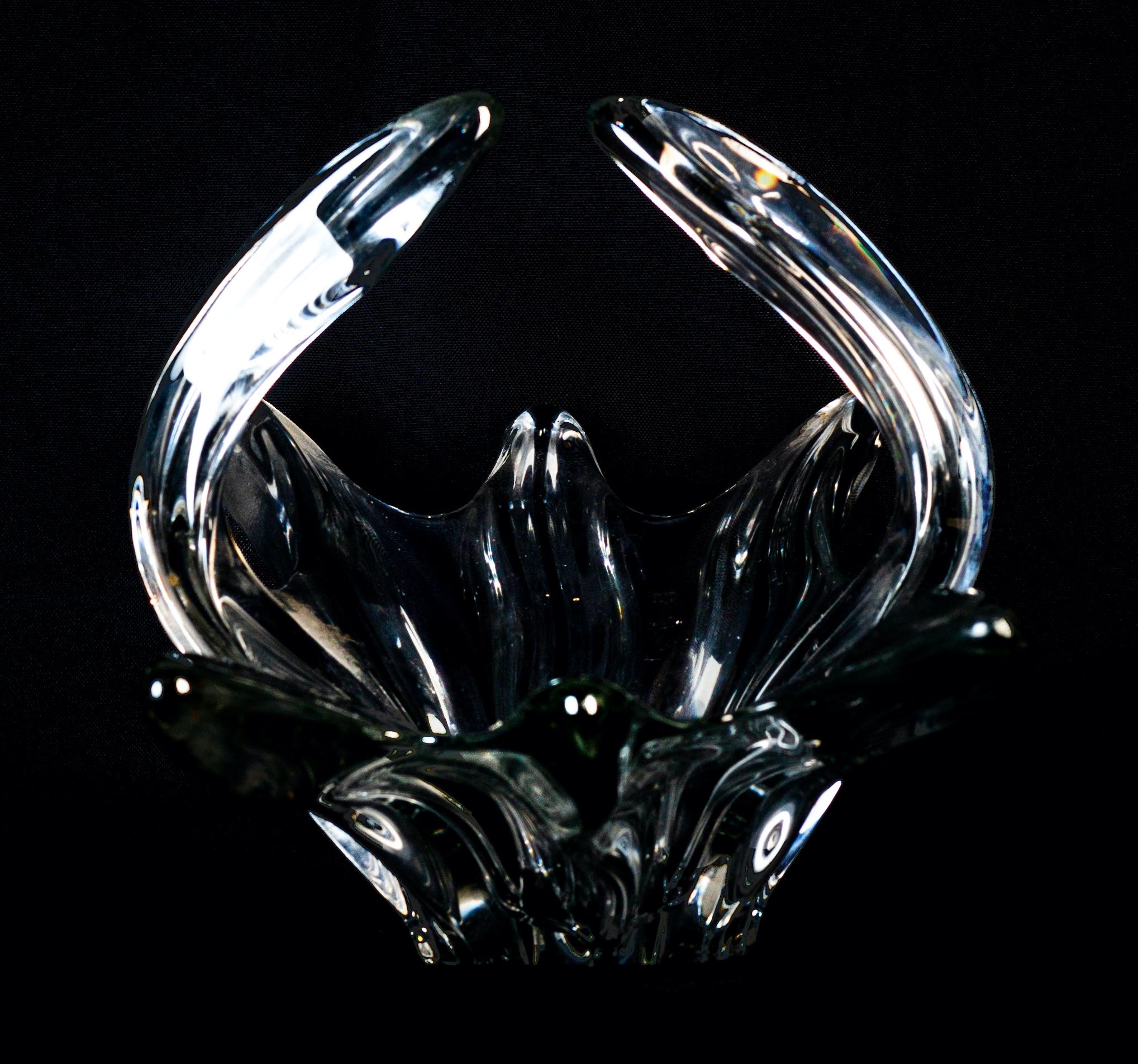 Hand blown centerpiece is a beautiful glass decorative object, realized by Murano manufacture during the 1970s.

This decorative object is a very elegant centerpiece.


This elegant, hand blown glass The large vintage piece features a pulled