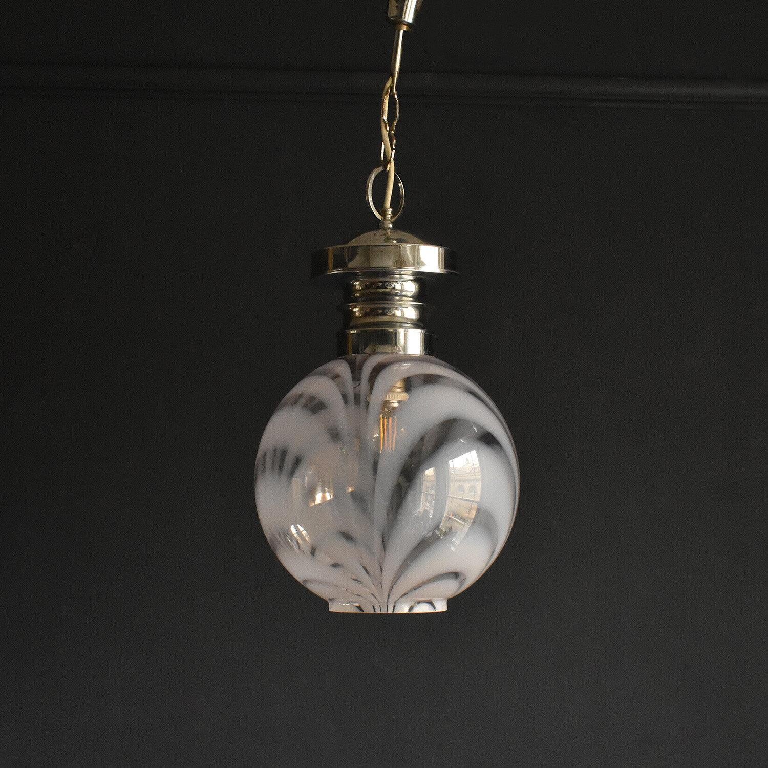 Vintage Ceiling Light Fitting

Wonderful opaline milk glass shade with swirls of clear glass.

Chrome stepped fitting.

In great vintage condition with some minor wear commensurate with age but nothing serious

Rewired and safety tested by our