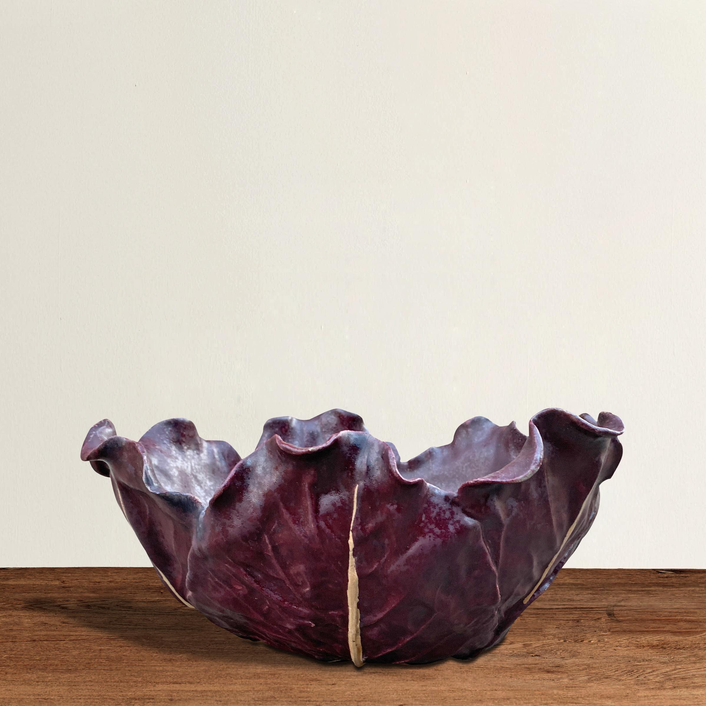 A wonderful and charming vintage hand-built ceramic red cabbage bowl with a fabulous glaze that you'd swear is the real deal. Sign illegibly on the bottom. Perfect for serving a small salad at your next garden party, but also holds its own sitting