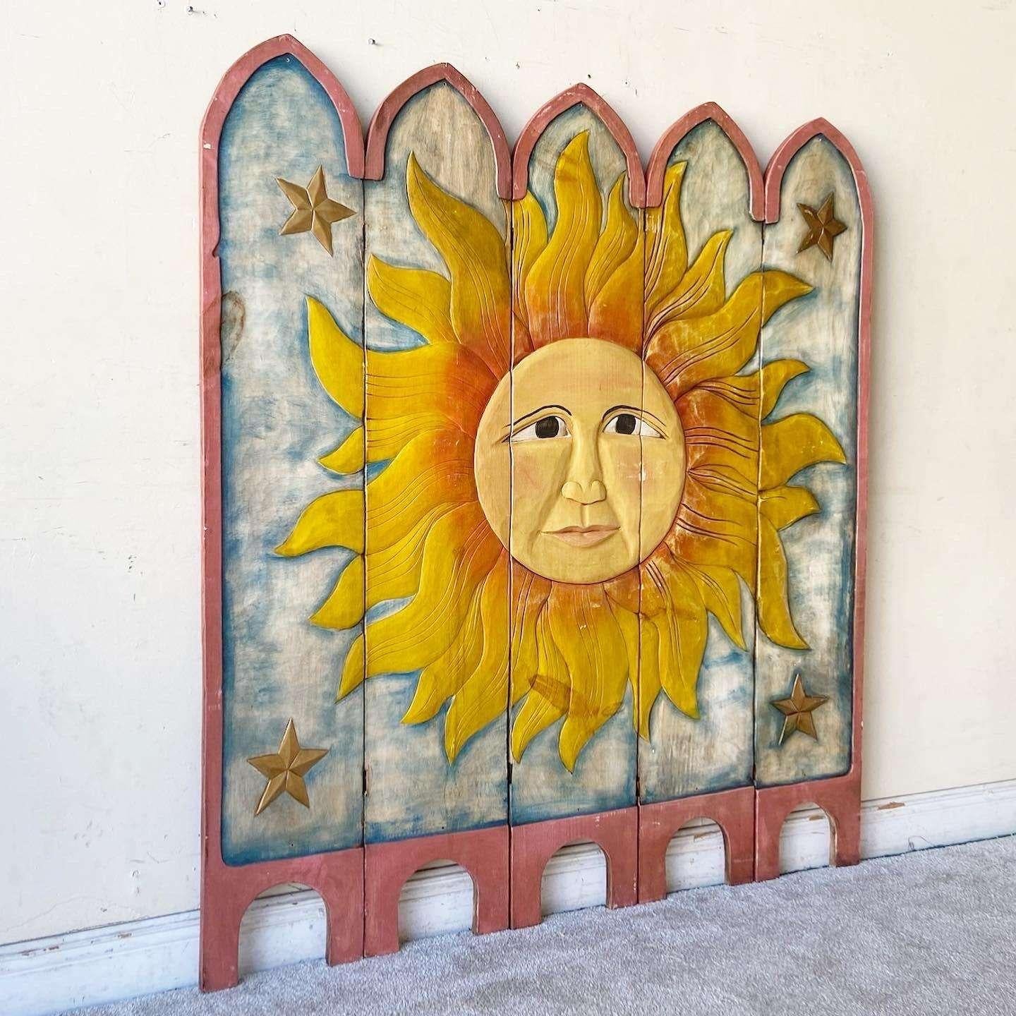 Wonderful vintage hand carved and painted screen. 4 panels have been fixed together on one side with a wooden slats and a glue. The fixed side displays an angels the displayed side features a sun face.
