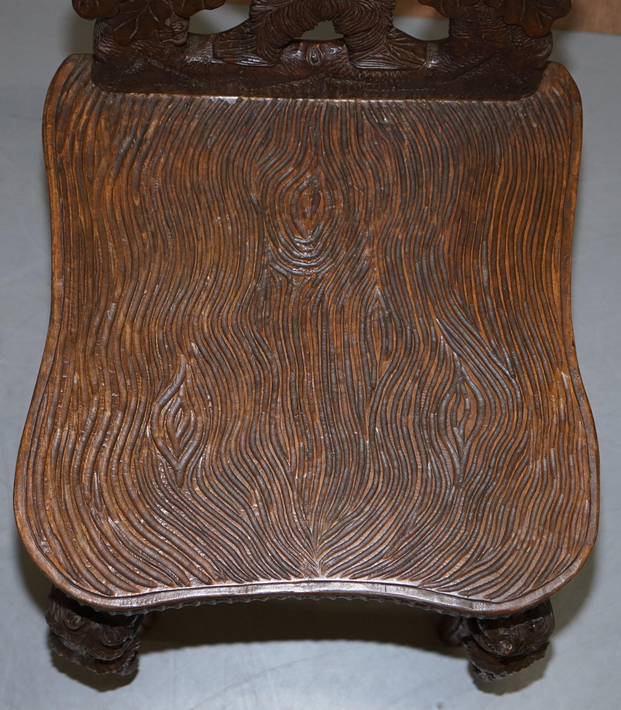 German Vintage Hand Carved Black Forest Wood Bear Chair with Bears Climbing the Legs
