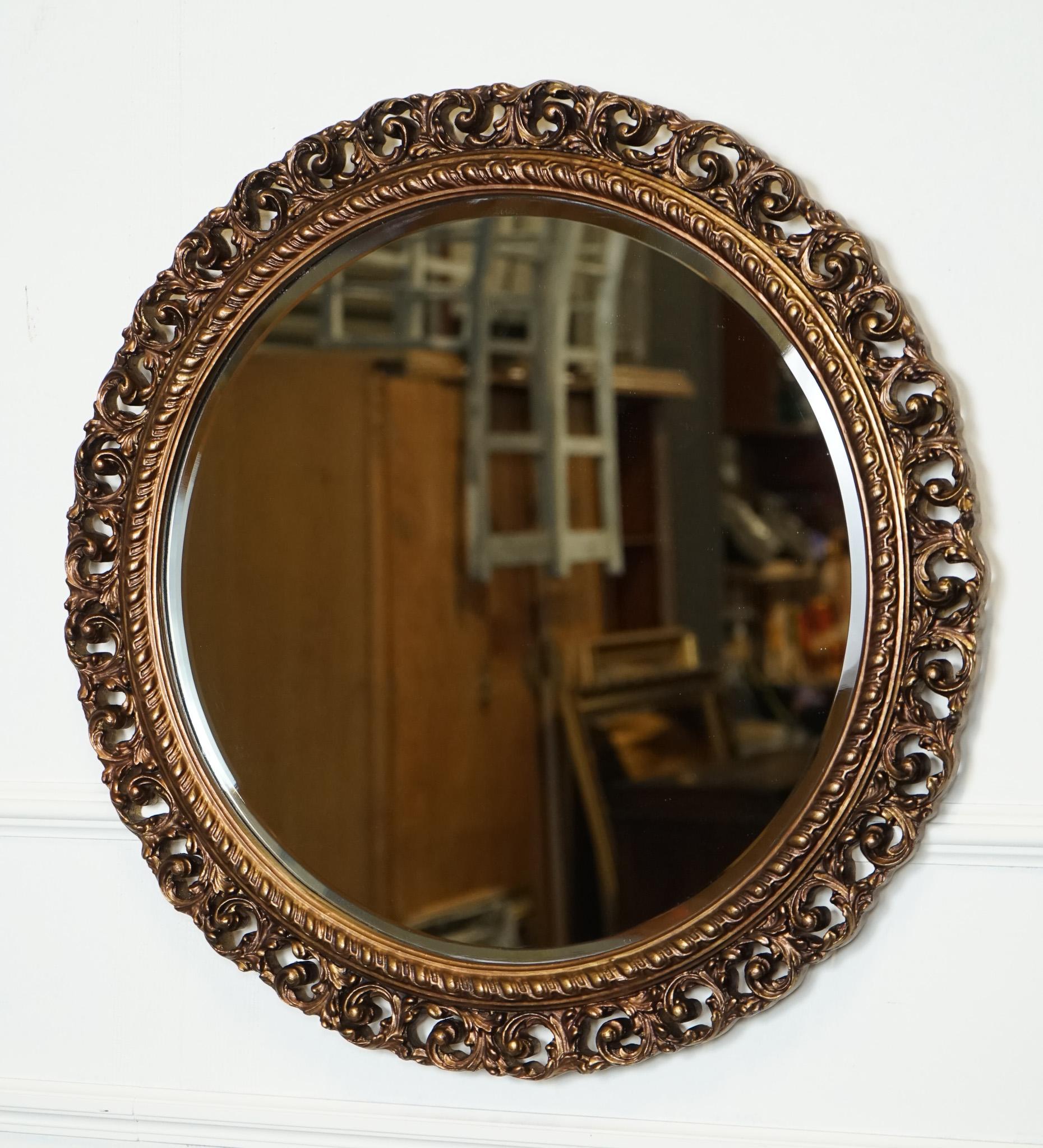 

We are delighted to offer for sale this Vintage Hand-carved Bronze Circular Bevelled Wall Mirror.

 A stunning piece of decor that exudes elegance and sophistication. The circular shape of the mirror adds a touch of classic charm to any