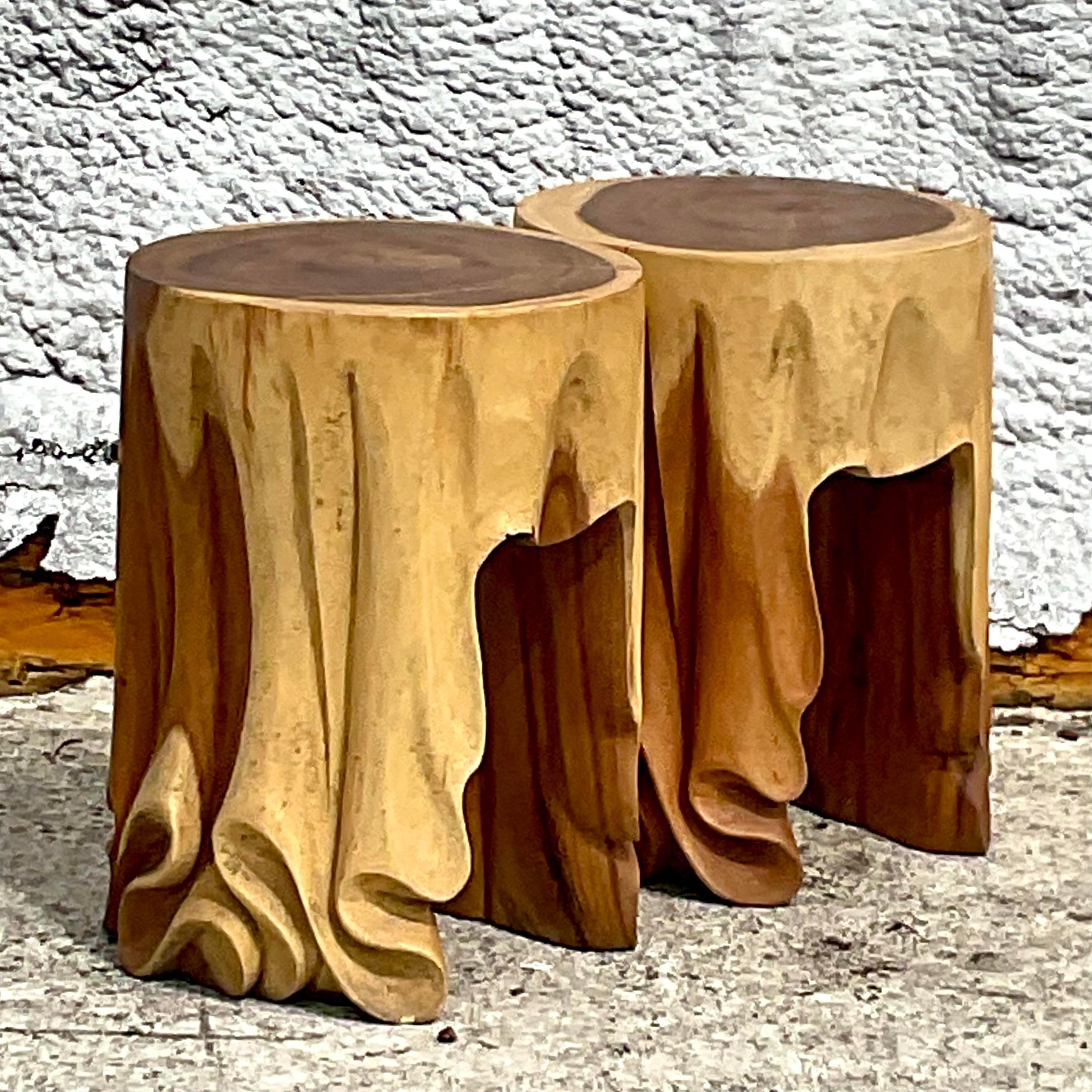 Crafted with timeless elegance, these hand-carved low stools exude quintessential American charm. Featuring intricate detailing and draped accents, this pair adds a touch of vintage sophistication to any space, inviting you to indulge in classic