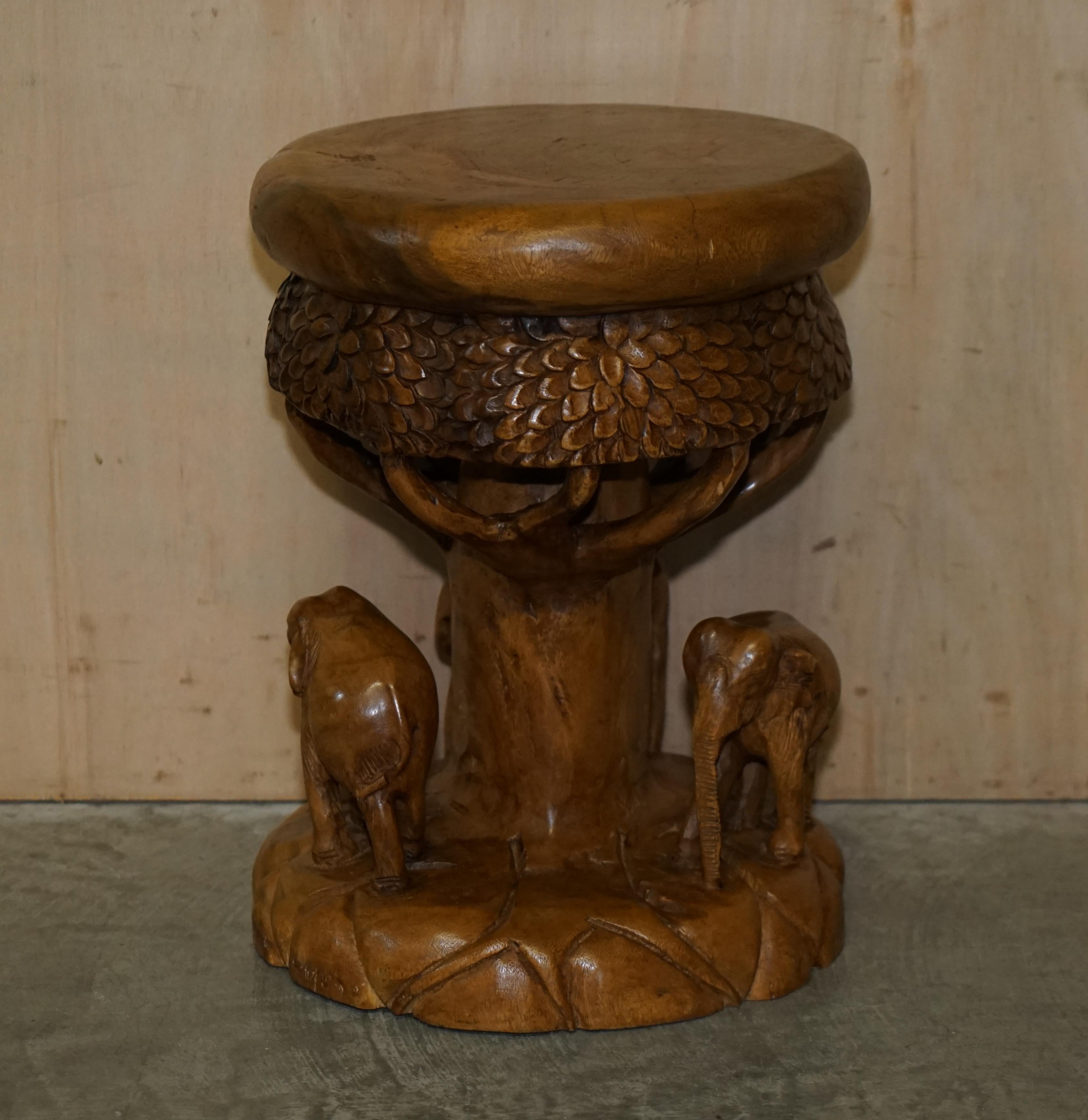 We are delighted to offer for sale this stunning hand carved Elephant stool with ornate detailing all over

A very good-looking and decorative stool, the Elephants look happy and playful from any side, they are nicely carved 

We have cleaned