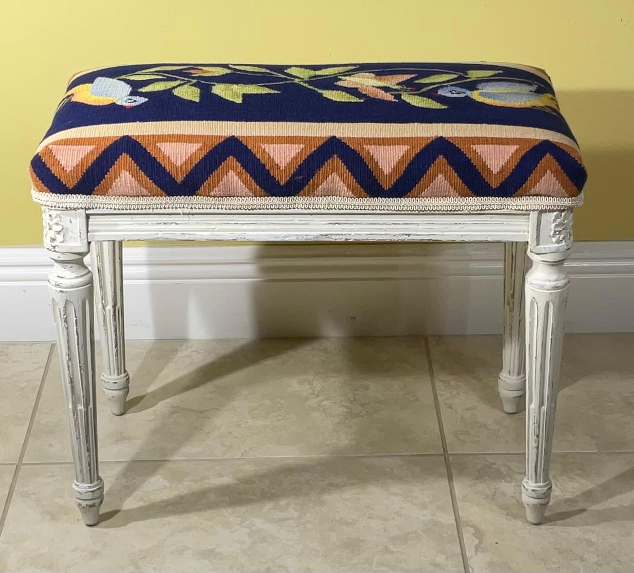elegant hand carved  stool upholstered with beautiful hand weave tapestry with two bird ,butterfly , and floral vine motif .
Exceptional object of art for display.