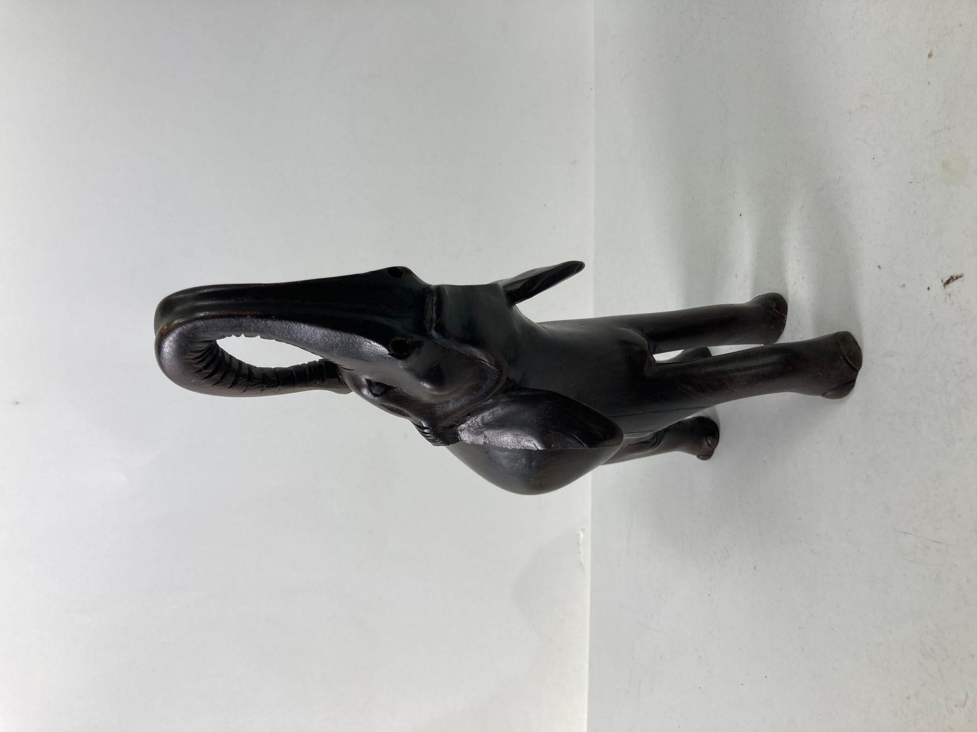 Vintage hand carved hard wood elephant sculpture.
Large heavy ebony dark wood hand carved Anglo Indian elephant sculpture.
Gorgeous vintage black hand carved wood ebony elephant.
This is a hand carved ebony wood lucky elephant.
Large vintage