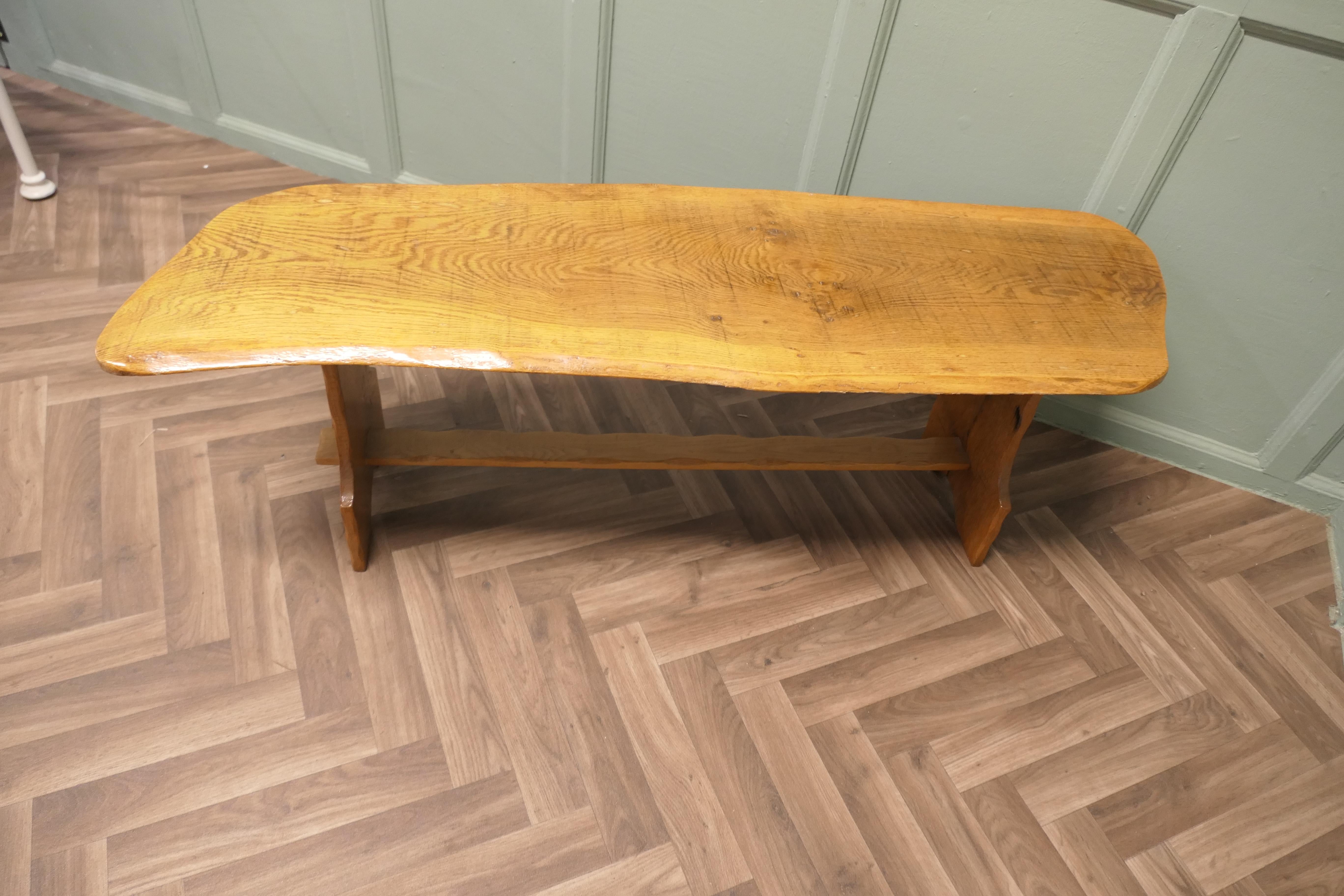 Vintage Hand Carved Live Edge Solid Plank Elm Coffee Table 

This is a good sturdy country made table, it has an irregular shaped elm top which has very attractive figuring, a large slice of elm as it was cut from the tree. The sturdy refectory