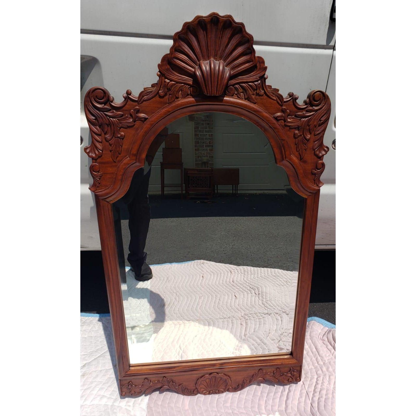 Intricately Carved Mahogany wall mirror. Excellent vintage condition.
Solid Mahogany. Hand carved attributed to the Bradburn Gallery
Measures 25