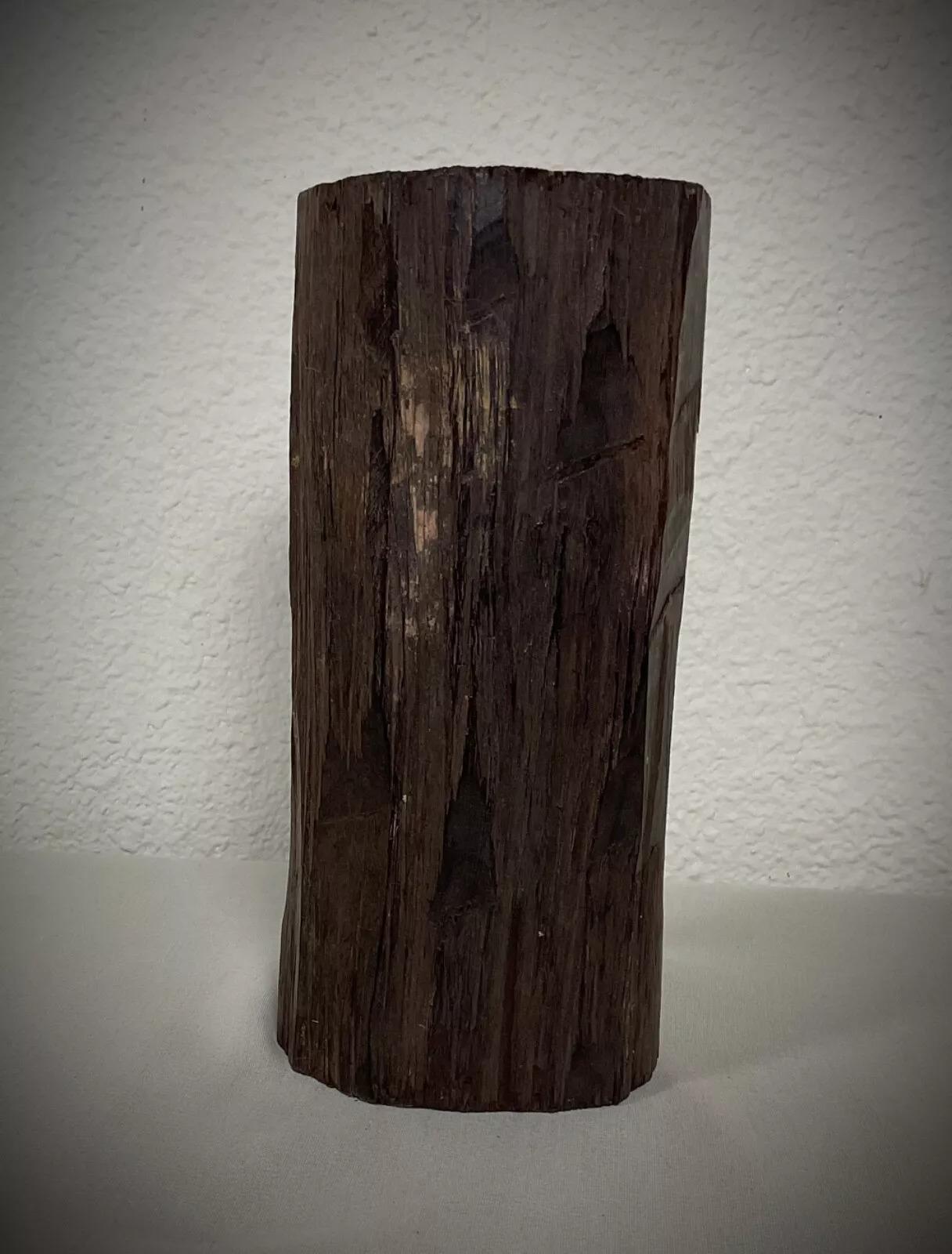 This is an authentic vintage hand-carved Malagasy sculpture depicting a nude female figure, crafted from solid ebony wood. Originating from Madagascar, this mid-20th-century piece (1950s-1960s) showcases exceptional craftsmanship, making it a