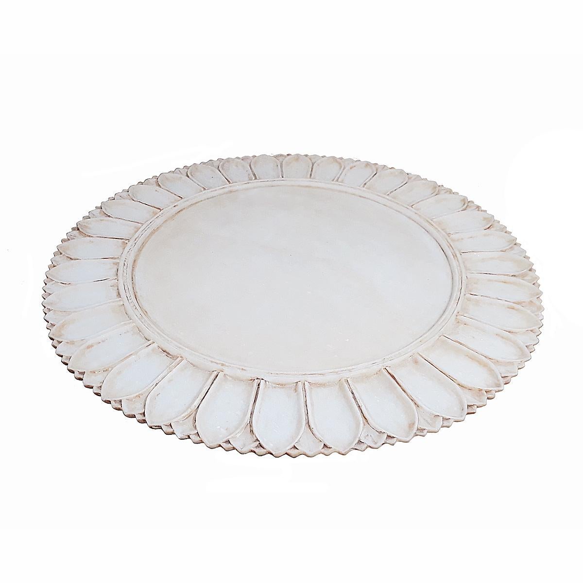 A superb Indian Marble plate, circa 1970-1975. 

Hand-carved from a single piece of marble. Natural patina conferred by age. Beautifully carved borders in a leaf pattern and concentric circles, defining a smooth center. Can be used as a server, as a