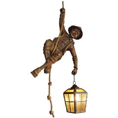 Used Hand Carved Mountaineer Sculpture Pendant Light w. Stained Glass Lantern