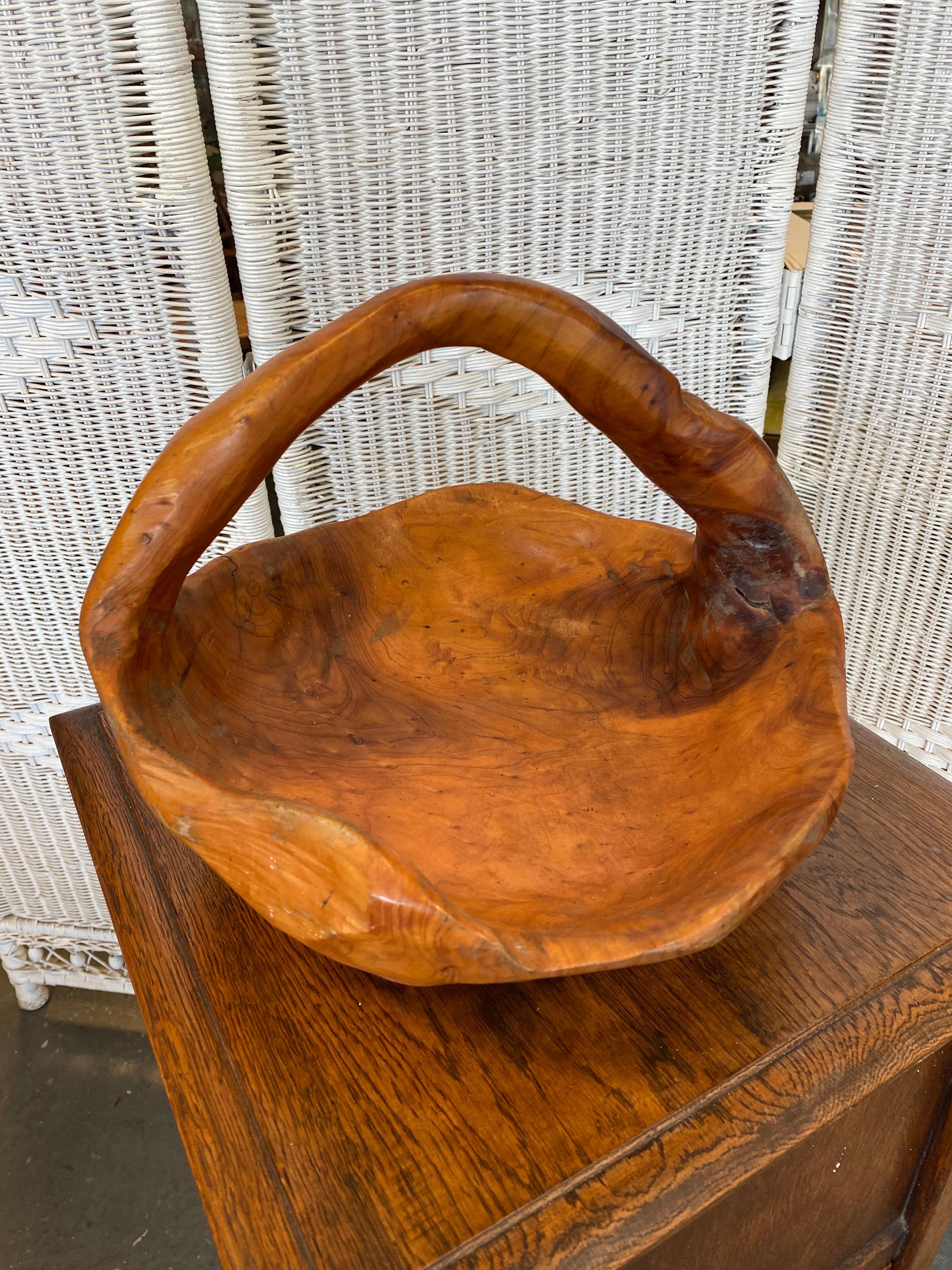 Beautiful bowl or basket carved out of redwood burl. An excellent piece to display your fruit or just use it as a decor piece on its own.