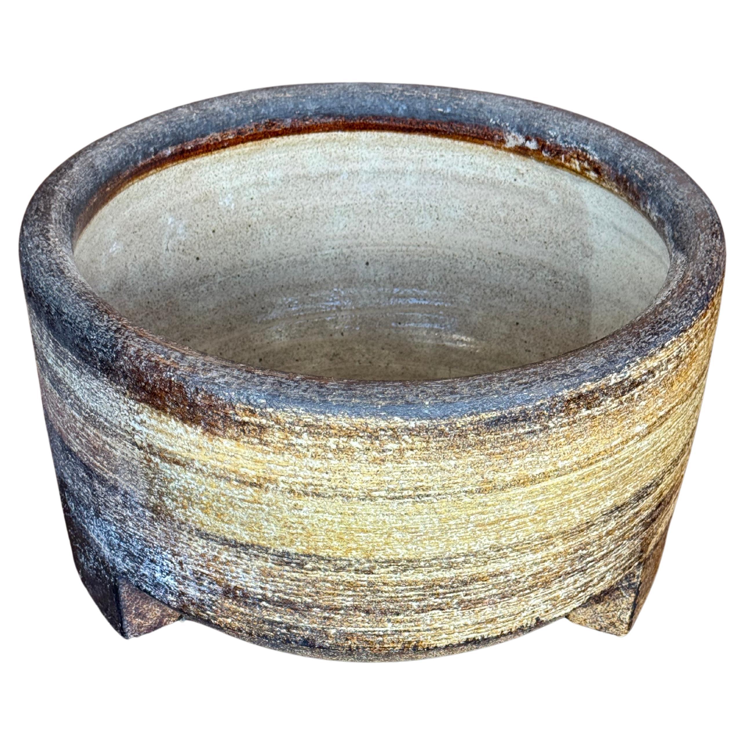 Introducing our Vintage Hand-Carved Solid Stone Planter/Bowl—a masterpiece of timeless elegance. Hand-carved with textural details, it boasts a honed, brushed finish that enhances the stone's natural beauty. With sturdy stone feet, it's suitable for
