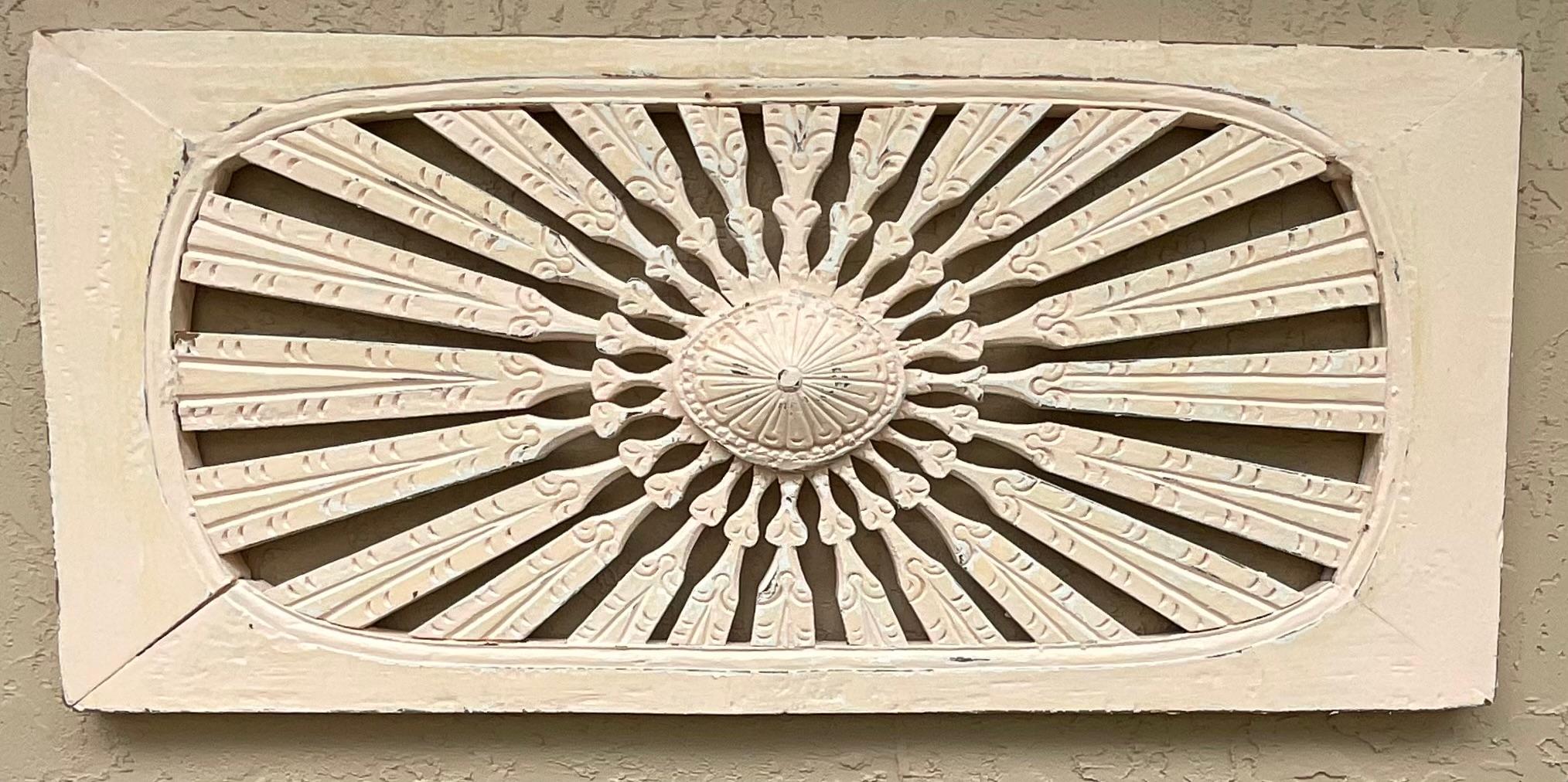 Beautiful hand carving wall hanging made from wood, with sun burst motif, hand painted in light peachy colour,  very nice patina. 
Great object of art for wall display.