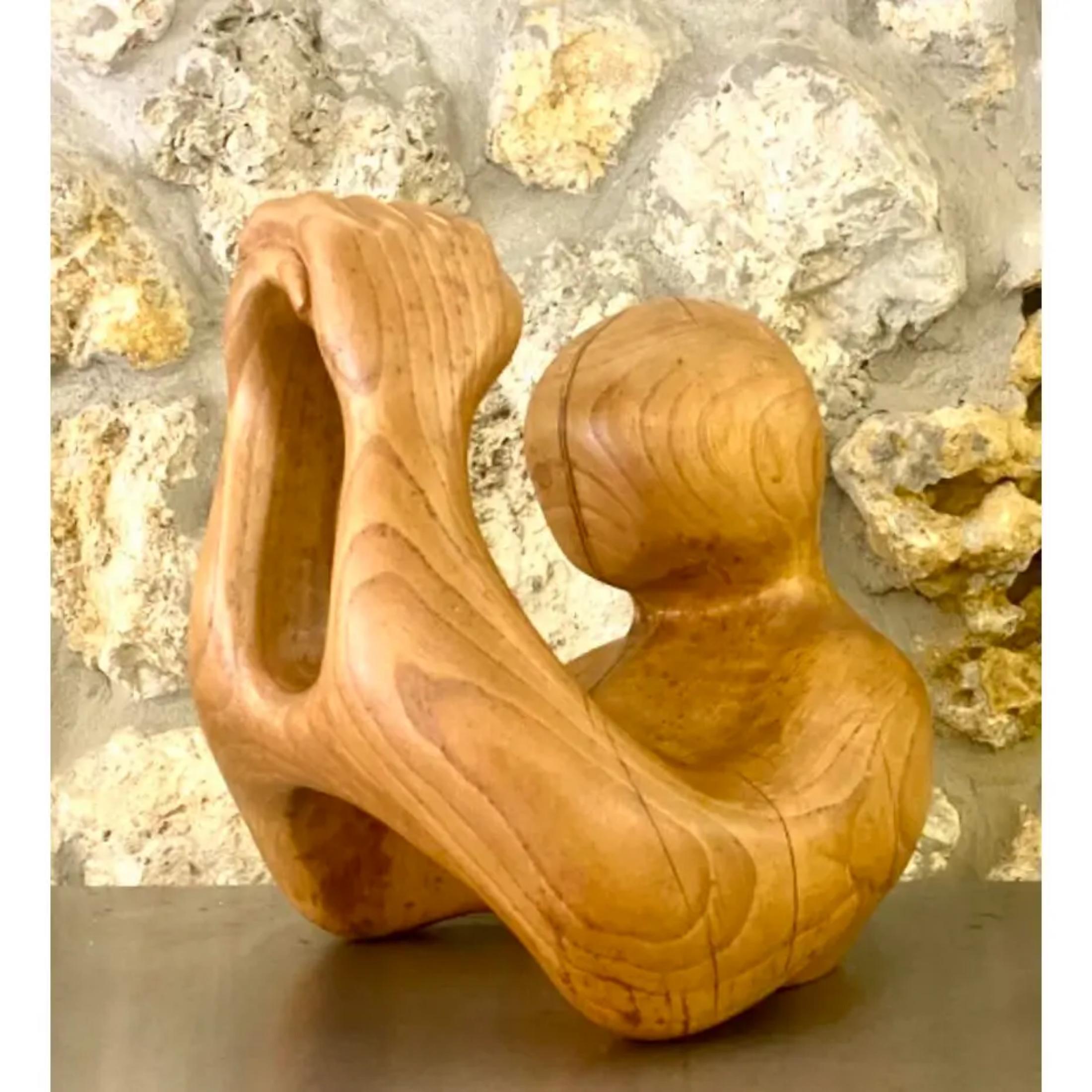 Fantastic vintage hand carved wood sculpture. A beautiful and serene abstract depiction of a figure in prayer. Gorgeous wood grain detail in a polished matte finish. Acquired from a Palm Beach estate
