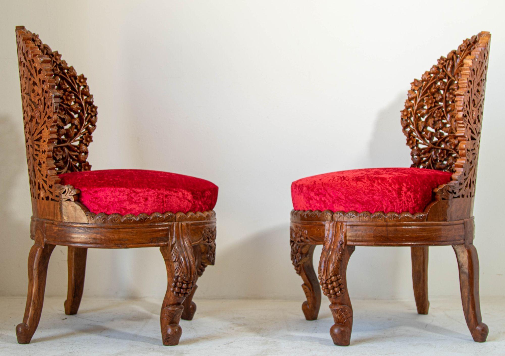 Vintage hand carved teak wooden chairs with red cushions.
Fabulous Anglo-Raj side chairs with foliate open carved wood back and carved legs.
Hand-carved Anglo-Indian chairs with finely detailed Intricately with the tree of life as the back